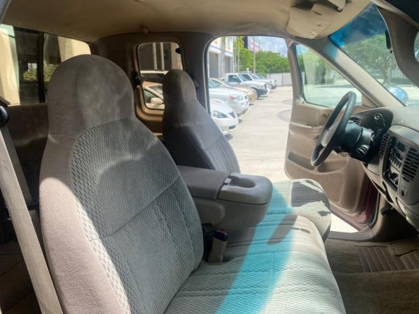 1997 Dark Toreador Red (CC/Met) /Medium Prarie Tan Ford F-150 XLT 1 OWNER LOW MILES 74,027 (1FTDX17W5VK) with an 4.6L EFI OHC V8 Triton Engine engine, Automatic transmission, located at 4701 North Dixie Hwy, Pompano Beach, FL, 33064, (954) 422-2889, 26.240938, -80.123474 - OUR WEBPAGE FLORIDACARS1.COM HAS OVER 100 PHOTOS AND FREE CARFAX LINK 1997 FORD F-150 XLT VIN: 1FTDX17W5VKB56866 1 F T D X 1 7 W 5 V K B 5 6 8 6 6 3 DOOR EXTENDED CAB PICKUP 4.6L V8 F GASOLINE REAR WHEEL DRIVE Top Features Cloth Seats Tow Hitch Basic Features ABS Brakes AM/FM Stereo Air Conditioning - Photo#12