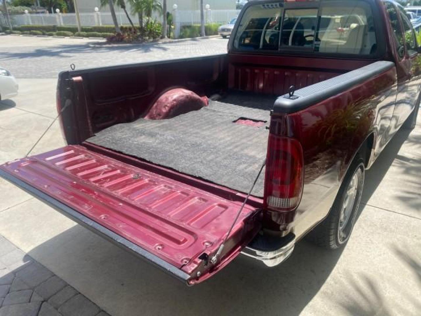 1997 Dark Toreador Red (CC/Met) /Medium Prarie Tan Ford F-150 XLT 1 OWNER LOW MILES 74,027 (1FTDX17W5VK) with an 4.6L EFI OHC V8 Triton Engine engine, Automatic transmission, located at 4701 North Dixie Hwy, Pompano Beach, FL, 33064, (954) 422-2889, 26.240938, -80.123474 - OUR WEBPAGE FLORIDACARS1.COM HAS OVER 100 PHOTOS AND FREE CARFAX LINK 1997 FORD F-150 XLT VIN: 1FTDX17W5VKB56866 1 F T D X 1 7 W 5 V K B 5 6 8 6 6 3 DOOR EXTENDED CAB PICKUP 4.6L V8 F GASOLINE REAR WHEEL DRIVE Top Features Cloth Seats Tow Hitch Basic Features ABS Brakes AM/FM Stereo Air Conditioning - Photo#79