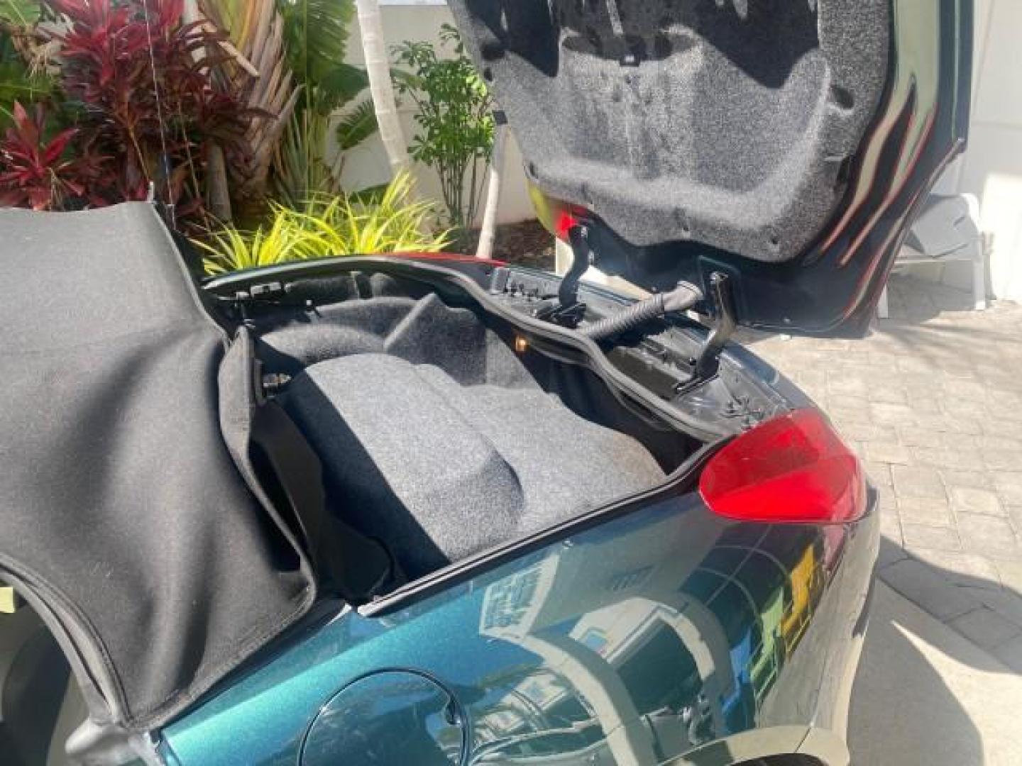2006 Envious Emerald Green Met /Steel/Sand Pontiac Solstice 1 OWNER LOW MILES 17,744 (1G2MB35B76Y) with an Ecotec 2.4L DOHC 4-Cyl SFI Aluminum Engine engine, Manual transmission, located at 4701 North Dixie Hwy, Pompano Beach, FL, 33064, (954) 422-2889, 26.240938, -80.123474 - OUR WEBPAGE FLORIDACARS1.COM HAS OVER 100 PHOTOS AND FREE CARFAX LINK 2006 PONTIAC SOLSTICE VIN: 1G2MB35B76Y116186 1 G 2 M B 3 5 B 7 6 Y 1 1 6 1 8 6 CONVERTIBLE 2.4L I4 F DOHC GASOLINE REAR WHEEL DRIVE Top Features Alloy Wheels Bluetooth Technology Convenience Package Leather Seats Soft Top Basic Fe - Photo#14
