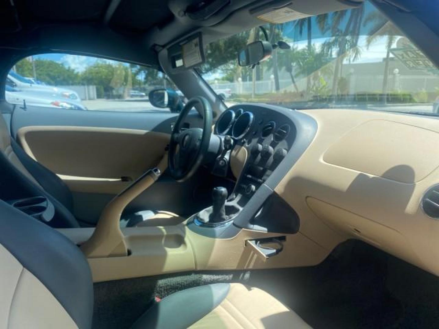 2006 Envious Emerald Green Met /Steel/Sand Pontiac Solstice 1 OWNER LOW MILES 17,744 (1G2MB35B76Y) with an Ecotec 2.4L DOHC 4-Cyl SFI Aluminum Engine engine, Manual transmission, located at 4701 North Dixie Hwy, Pompano Beach, FL, 33064, (954) 422-2889, 26.240938, -80.123474 - OUR WEBPAGE FLORIDACARS1.COM HAS OVER 100 PHOTOS AND FREE CARFAX LINK 2006 PONTIAC SOLSTICE VIN: 1G2MB35B76Y116186 1 G 2 M B 3 5 B 7 6 Y 1 1 6 1 8 6 CONVERTIBLE 2.4L I4 F DOHC GASOLINE REAR WHEEL DRIVE Top Features Alloy Wheels Bluetooth Technology Convenience Package Leather Seats Soft Top Basic Fe - Photo#85