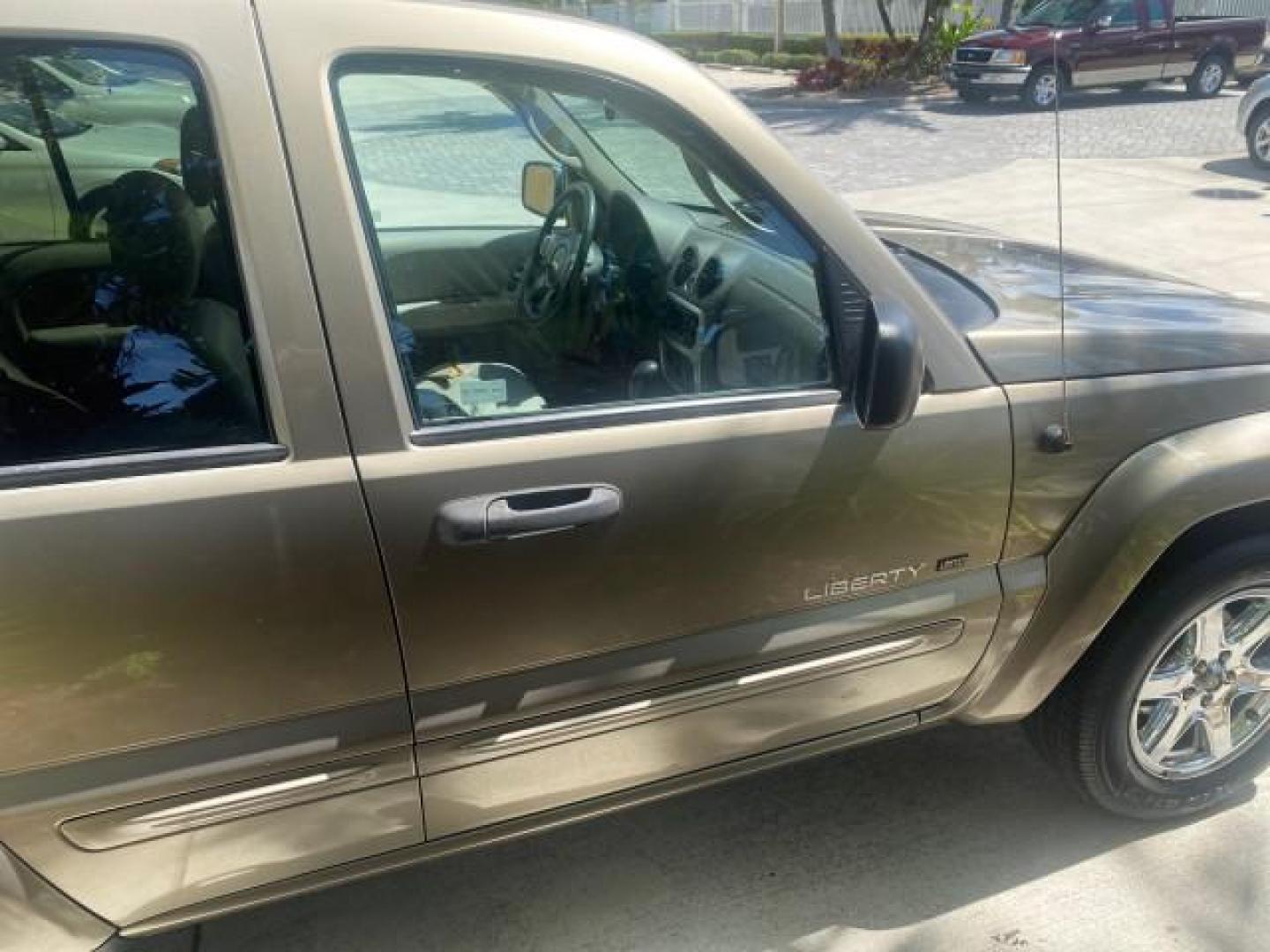 2003 Cactus Green Pearl Coat /Dark Slate Gray Jeep Liberty Limited 1 OWNER LOW MILES 71,149 (1J4GK58KX3W) with an 3.7L V6 Engine engine, Automatic transmission, located at 4701 North Dixie Hwy, Pompano Beach, FL, 33064, (954) 422-2889, 26.240938, -80.123474 - OUR WEBPAGE FLORIDACARS1.COM HAS OVER 100 PHOTOS AND FREE CARFAX LINK 2003 JEEP LIBERTY LIMITED VIN: 1J4GK58KX3W598220 1 J 4 G K 5 8 K X 3 W 5 9 8 2 2 0 4 DOOR WAGON/SPORT UTILITY 3.7L V6 F GASOLINE REAR WHEEL DRIVE Top Features Alloy Wheels Leather Seats Tow Hitch Basic Features AM/FM Stereo Air Co - Photo#97