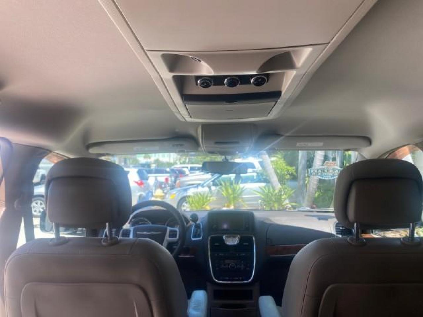 2014 Brilliant Black Crystal Pearlcoa /Dk Frost Beige/Med Beige Chrysler Town and Country Touring 1 OWNER LOW MILES 65,691 (2C4RC1BG1ER) with an 3.6L V6 Cylinder Engine engine, Automatic transmission, located at 4701 North Dixie Hwy, Pompano Beach, FL, 33064, (954) 422-2889, 26.240938, -80.123474 - OUR WEBPAGE FLORIDACARS1.COM HAS OVER 100 PHOTOS AND FREE CARFAX LINK 2014 CHRYSLER TOWN AND COUNTRY TOURING VIN: 2C4RC1BG1ER374547 2 C 4 R C 1 B G 1 E R 3 7 4 5 4 7 VAN 3.6L V6 F DOHC 24V GASOLINE FRONT WHEEL DRIVE Top Features Alloy Wheels Anniversary Edition Blind Spot Monitor Bluetooth Technolog - Photo#76