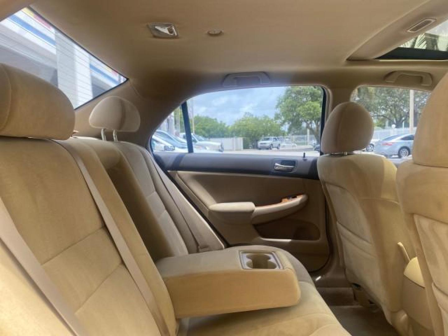 2004 Graphite Pearl /Ivory Honda Accord Sdn EX 1 OWNER LOW MILES 63,652 (1HGCM56614A) with an 2.4L DOHC MPFI 16-Valve i-VTEC I4 Engine engine, Automatic transmission, located at 4701 North Dixie Hwy, Pompano Beach, FL, 33064, (954) 422-2889, 26.240938, -80.123474 - OUR WEBPAGE FLORIDACARS1.COM HAS OVER 100 PHOTOS AND FREE CARFAX LINK 2004 HONDA ACCORD EX VIN: 1HGCM56614A033648 1 H G C M 5 6 6 1 4 A 0 3 3 6 4 8 SEDAN 4 DR 2.4L I4 F DOHC GASOLINE FRONT WHEEL DRIVE Top Features Alloy Wheels Cloth Seats Sunroof(s) Basic Features ABS Brakes AM/FM Stereo Air Conditi - Photo#95