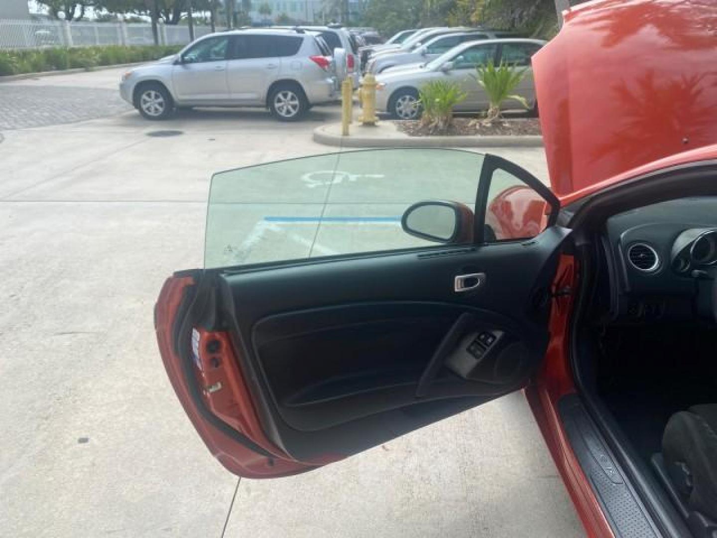 2008 Rave Red Pearl /Dark Charcoal Mitsubishi Eclipse GS LOW MILES 53,445 (4A3AL25F58E) with an 2.4L SOHC MPFI 16-Valve MIVEC I4 Engine engine, Automatic transmission, located at 4701 North Dixie Hwy, Pompano Beach, FL, 33064, (954) 422-2889, 26.240938, -80.123474 - OUR WEBPAGE FLORIDACARS1.COM HAS OVER 100 PHOTOS AND FREE CARFAX LINK 2008 MITSUBISHI ECLIPSE SPYDER GS VIN: 4A3AL25F58E038789 4 A 3 A L 2 5 F 5 8 E 0 3 8 7 8 9 CONVERTIBLE 2.4L I4 F SOHC 16V GASOLINE FRONT WHEEL DRIVE Top Features Alloy Wheels Cloth Seats Rockford Fosgate Sound Satellite Radio Read - Photo#9