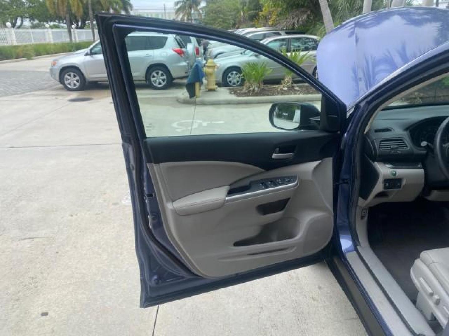 2014 Twilight Blue Metallic /Gray Honda CR-V EX-L LOW MILES 27,328 1 OWNER (2HKRM3H72EH) with an 2.4L I-4 16-Valve DOHC i-VTEC Engine engine, Automatic transmission, located at 4701 North Dixie Hwy, Pompano Beach, FL, 33064, (954) 422-2889, 26.240938, -80.123474 - OUR WEBPAGE FLORIDACARS1.COM HAS OVER 100 PHOTOS AND FREE CARFAX LINK 2014 HONDA CR-V EX-L VIN: 2HKRM3H72EH534254 2 H K R M 3 H 7 2 E H 5 3 4 2 5 4 4 DOOR WAGON/SPORT UTILITY 2.4L I4 F DOHC 16V GASOLINE FRONT WHEEL DRIVE Top Features Alloy Wheels Bluetooth Technology Front Seat Heaters Leather Seats - Photo#9