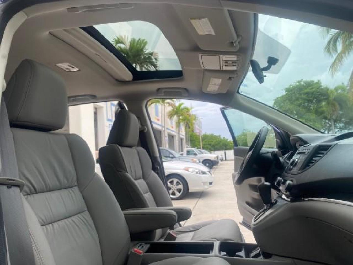 2014 Twilight Blue Metallic /Gray Honda CR-V EX-L LOW MILES 27,328 1 OWNER (2HKRM3H72EH) with an 2.4L I-4 16-Valve DOHC i-VTEC Engine engine, Automatic transmission, located at 4701 North Dixie Hwy, Pompano Beach, FL, 33064, (954) 422-2889, 26.240938, -80.123474 - OUR WEBPAGE FLORIDACARS1.COM HAS OVER 100 PHOTOS AND FREE CARFAX LINK 2014 HONDA CR-V EX-L VIN: 2HKRM3H72EH534254 2 H K R M 3 H 7 2 E H 5 3 4 2 5 4 4 DOOR WAGON/SPORT UTILITY 2.4L I4 F DOHC 16V GASOLINE FRONT WHEEL DRIVE Top Features Alloy Wheels Bluetooth Technology Front Seat Heaters Leather Seats - Photo#12