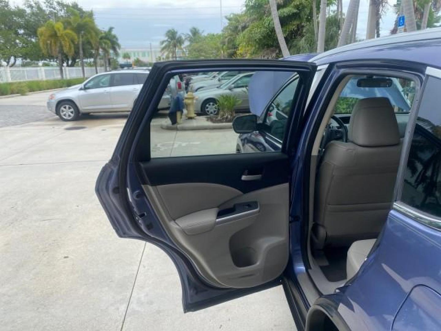 2014 Twilight Blue Metallic /Gray Honda CR-V EX-L LOW MILES 27,328 1 OWNER (2HKRM3H72EH) with an 2.4L I-4 16-Valve DOHC i-VTEC Engine engine, Automatic transmission, located at 4701 North Dixie Hwy, Pompano Beach, FL, 33064, (954) 422-2889, 26.240938, -80.123474 - OUR WEBPAGE FLORIDACARS1.COM HAS OVER 100 PHOTOS AND FREE CARFAX LINK 2014 HONDA CR-V EX-L VIN: 2HKRM3H72EH534254 2 H K R M 3 H 7 2 E H 5 3 4 2 5 4 4 DOOR WAGON/SPORT UTILITY 2.4L I4 F DOHC 16V GASOLINE FRONT WHEEL DRIVE Top Features Alloy Wheels Bluetooth Technology Front Seat Heaters Leather Seats - Photo#13