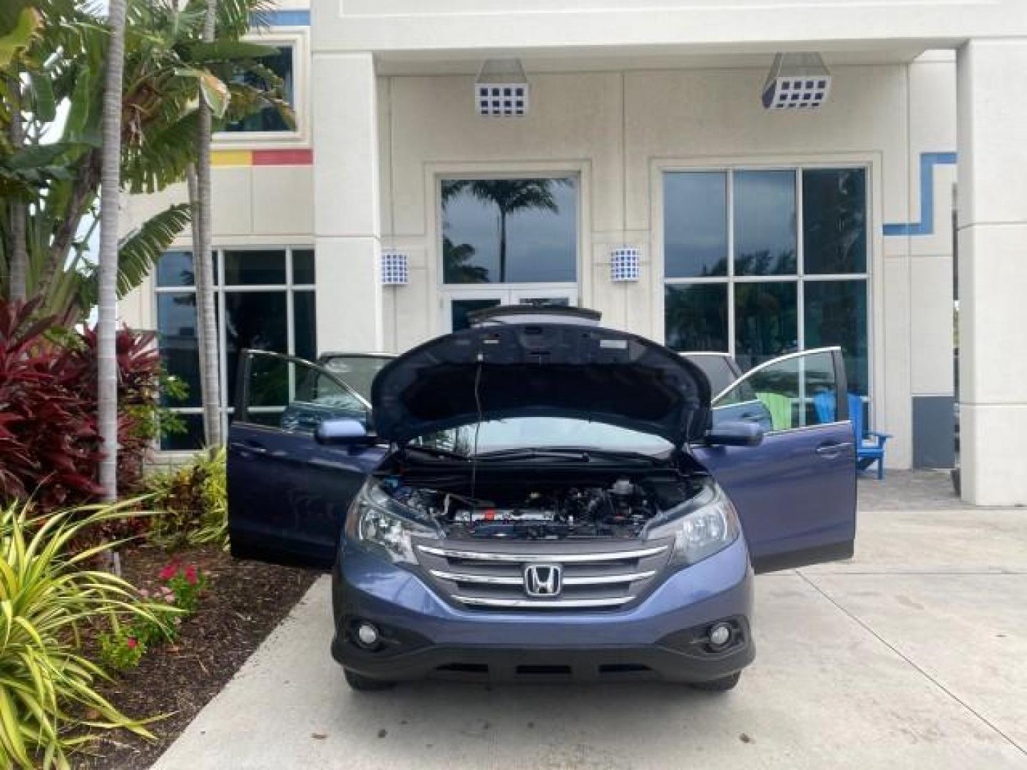 2014 Twilight Blue Metallic /Gray Honda CR-V EX-L LOW MILES 27,328 1 OWNER (2HKRM3H72EH) with an 2.4L I-4 16-Valve DOHC i-VTEC Engine engine, Automatic transmission, located at 4701 North Dixie Hwy, Pompano Beach, FL, 33064, (954) 422-2889, 26.240938, -80.123474 - OUR WEBPAGE FLORIDACARS1.COM HAS OVER 100 PHOTOS AND FREE CARFAX LINK 2014 HONDA CR-V EX-L VIN: 2HKRM3H72EH534254 2 H K R M 3 H 7 2 E H 5 3 4 2 5 4 4 DOOR WAGON/SPORT UTILITY 2.4L I4 F DOHC 16V GASOLINE FRONT WHEEL DRIVE Top Features Alloy Wheels Bluetooth Technology Front Seat Heaters Leather Seats - Photo#16