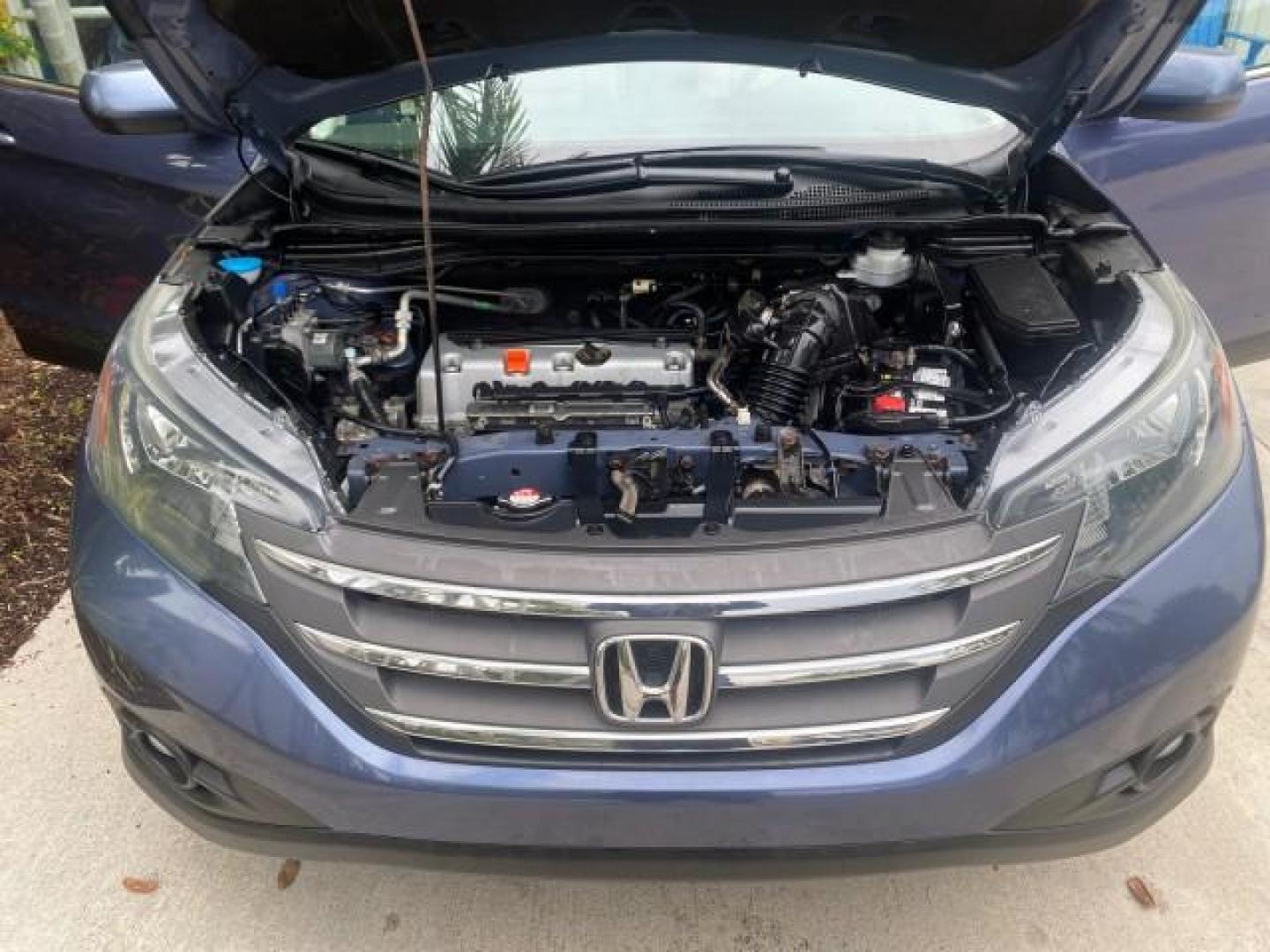 2014 Twilight Blue Metallic /Gray Honda CR-V EX-L LOW MILES 27,328 1 OWNER (2HKRM3H72EH) with an 2.4L I-4 16-Valve DOHC i-VTEC Engine engine, Automatic transmission, located at 4701 North Dixie Hwy, Pompano Beach, FL, 33064, (954) 422-2889, 26.240938, -80.123474 - OUR WEBPAGE FLORIDACARS1.COM HAS OVER 100 PHOTOS AND FREE CARFAX LINK 2014 HONDA CR-V EX-L VIN: 2HKRM3H72EH534254 2 H K R M 3 H 7 2 E H 5 3 4 2 5 4 4 DOOR WAGON/SPORT UTILITY 2.4L I4 F DOHC 16V GASOLINE FRONT WHEEL DRIVE Top Features Alloy Wheels Bluetooth Technology Front Seat Heaters Leather Seats - Photo#17