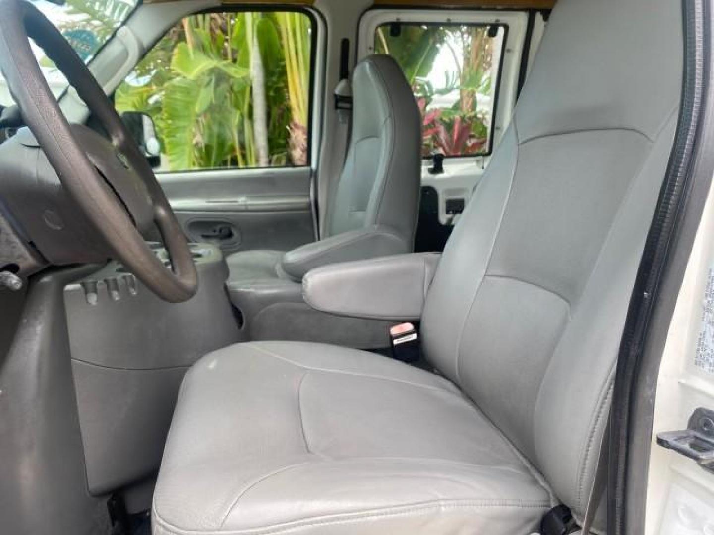 2005 Yellow Metallic /Medium Flint Ford Econoline Wagon 15 PASSENGER XL LOW MILES 49,408 (1FBSS31L05H) with an 5.4L EFI V8 Engine engine, Automatic transmission, located at 4701 North Dixie Hwy, Pompano Beach, FL, 33064, (954) 422-2889, 26.240938, -80.123474 - OUR WEBPAGE FLORIDACARS1.COM HAS OVER 100 PHOTOS AND FREE CARFAX LINK 2005 FORD E-SERIES E-350 SD XLT WE LOCATTED 2 REAR SEATS TO MAKE IT A 15 PASSEGER VIN: 1FBSS31L05HA95671 1 F B S S 3 1 L 0 5 H A 9 5 6 7 1 VAN 5.4L V8 F GASOLINE REAR WHEEL DRIVE Top Features Rear Air Conditioning Third Row Seat V - Photo#34