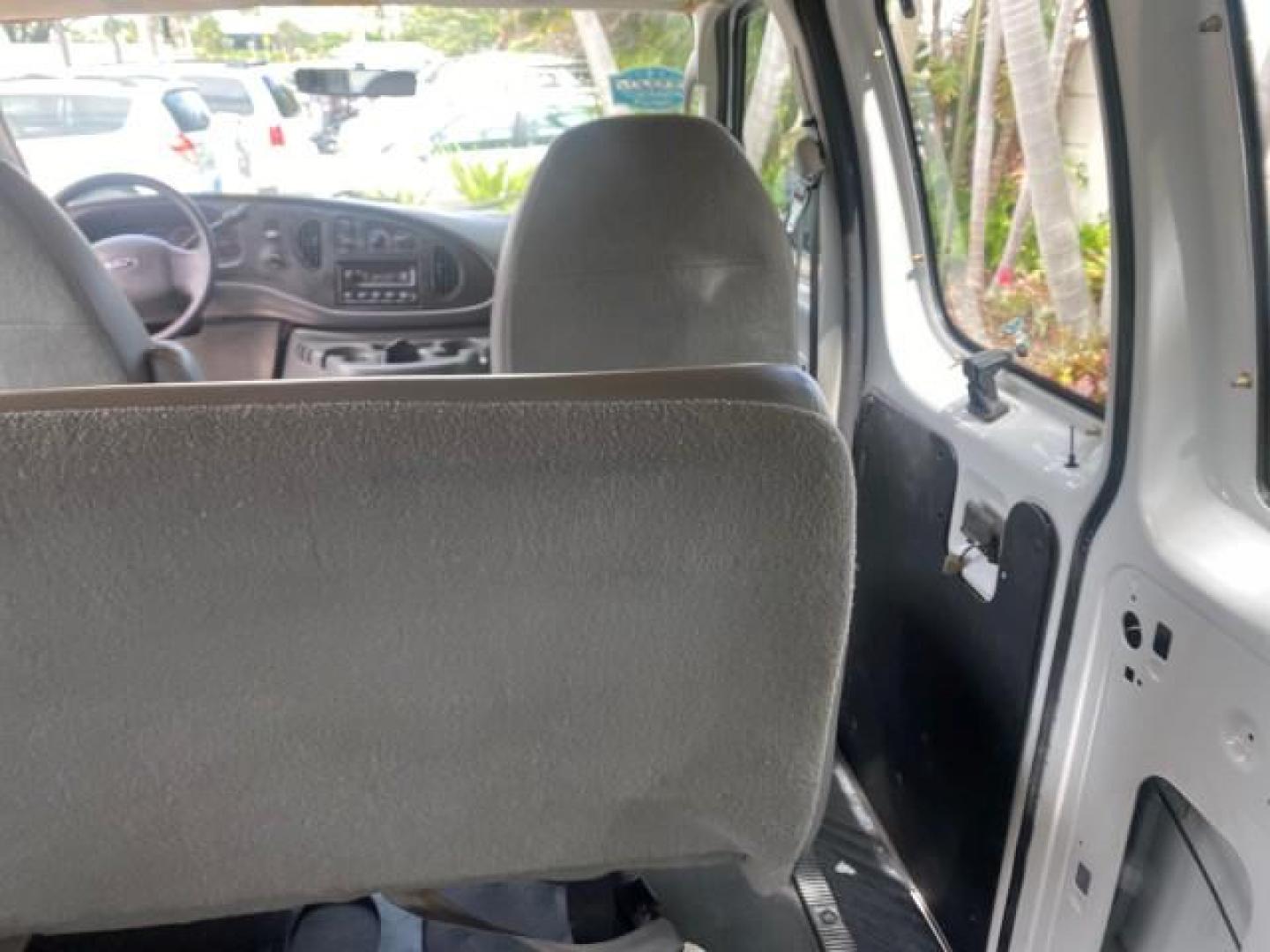 2005 Yellow Metallic /Medium Flint Ford Econoline Wagon 15 PASSENGER XL LOW MILES 49,408 (1FBSS31L05H) with an 5.4L EFI V8 Engine engine, Automatic transmission, located at 4701 North Dixie Hwy, Pompano Beach, FL, 33064, (954) 422-2889, 26.240938, -80.123474 - OUR WEBPAGE FLORIDACARS1.COM HAS OVER 100 PHOTOS AND FREE CARFAX LINK 2005 FORD E-SERIES E-350 SD XLT WE LOCATTED 2 REAR SEATS TO MAKE IT A 15 PASSEGER VIN: 1FBSS31L05HA95671 1 F B S S 3 1 L 0 5 H A 9 5 6 7 1 VAN 5.4L V8 F GASOLINE REAR WHEEL DRIVE Top Features Rear Air Conditioning Third Row Seat V - Photo#99