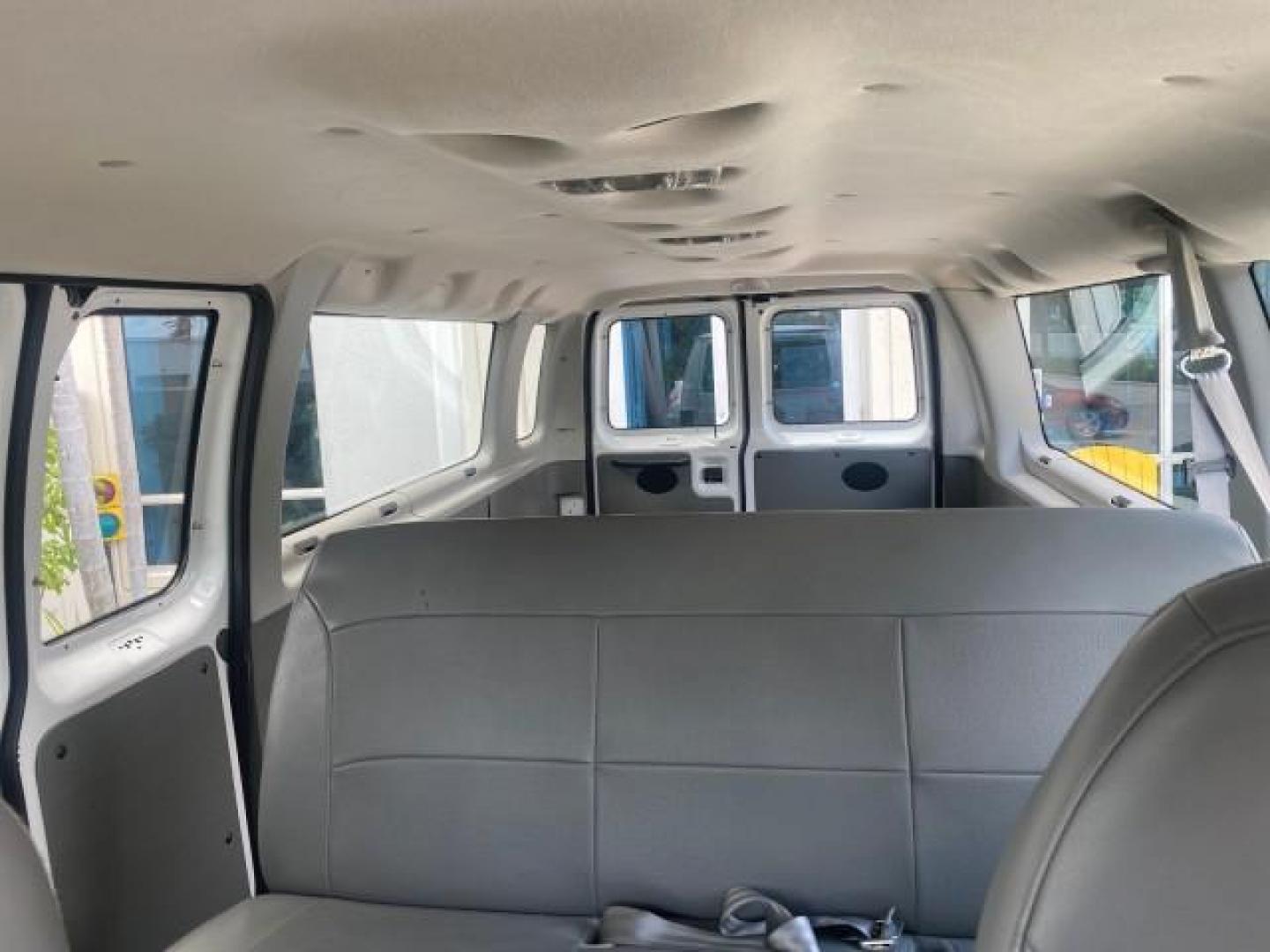 2005 Oxford White /Medium Flint Ford Econoline Wagon 5 PASSENGER XL LOW MILES 49,408 (1FBSS31L05H) with an 5.4L EFI V8 Engine engine, Automatic transmission, located at 4701 North Dixie Hwy, Pompano Beach, FL, 33064, (954) 422-2889, 26.240938, -80.123474 - OUR WEBPAGE FLORIDACARS1.COM HAS OVER 100 PHOTOS AND FREE CARFAX LINK 2005 FORD E-SERIES E-350 SD XLT 5PASSENGER VIN: 1FBSS31L05HA95671 1 F B S S 3 1 L 0 5 H A 9 5 6 7 1 VAN 5.4L V8 F GASOLINE REAR WHEEL DRIVE Top Features Rear Air Conditioning Third Row Seat Vinyl Seats Basic Features ABS Brakes AM - Photo#59
