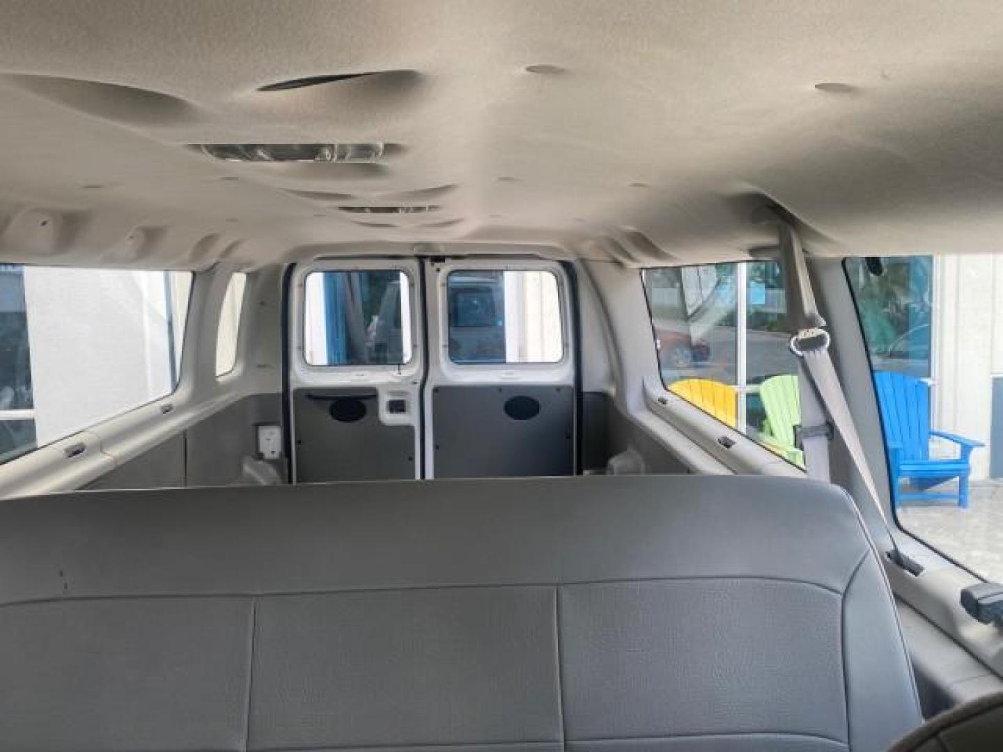 2005 Oxford White /Medium Flint Ford Econoline Wagon 5 PASSENGER XL LOW MILES 49,408 (1FBSS31L05H) with an 5.4L EFI V8 Engine engine, Automatic transmission, located at 4701 North Dixie Hwy, Pompano Beach, FL, 33064, (954) 422-2889, 26.240938, -80.123474 - OUR WEBPAGE FLORIDACARS1.COM HAS OVER 100 PHOTOS AND FREE CARFAX LINK 2005 FORD E-SERIES E-350 SD XLT 5PASSENGER VIN: 1FBSS31L05HA95671 1 F B S S 3 1 L 0 5 H A 9 5 6 7 1 VAN 5.4L V8 F GASOLINE REAR WHEEL DRIVE Top Features Rear Air Conditioning Third Row Seat Vinyl Seats Basic Features ABS Brakes AM - Photo#60