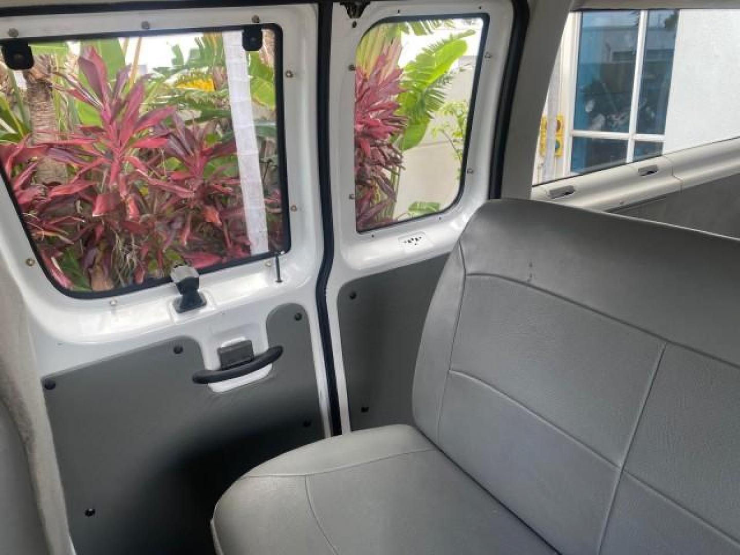 2005 Oxford White /Medium Flint Ford Econoline Wagon 5 PASSENGER XL LOW MILES 49,408 (1FBSS31L05H) with an 5.4L EFI V8 Engine engine, Automatic transmission, located at 4701 North Dixie Hwy, Pompano Beach, FL, 33064, (954) 422-2889, 26.240938, -80.123474 - OUR WEBPAGE FLORIDACARS1.COM HAS OVER 100 PHOTOS AND FREE CARFAX LINK 2005 FORD E-SERIES E-350 SD XLT 5PASSENGER VIN: 1FBSS31L05HA95671 1 F B S S 3 1 L 0 5 H A 9 5 6 7 1 VAN 5.4L V8 F GASOLINE REAR WHEEL DRIVE Top Features Rear Air Conditioning Third Row Seat Vinyl Seats Basic Features ABS Brakes AM - Photo#63