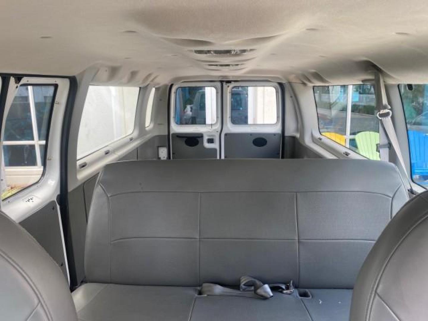 2005 Oxford White /Medium Flint Ford Econoline Wagon 5 PASSENGER XL LOW MILES 49,408 (1FBSS31L05H) with an 5.4L EFI V8 Engine engine, Automatic transmission, located at 4701 North Dixie Hwy, Pompano Beach, FL, 33064, (954) 422-2889, 26.240938, -80.123474 - OUR WEBPAGE FLORIDACARS1.COM HAS OVER 100 PHOTOS AND FREE CARFAX LINK 2005 FORD E-SERIES E-350 SD XLT 5PASSENGER VIN: 1FBSS31L05HA95671 1 F B S S 3 1 L 0 5 H A 9 5 6 7 1 VAN 5.4L V8 F GASOLINE REAR WHEEL DRIVE Top Features Rear Air Conditioning Third Row Seat Vinyl Seats Basic Features ABS Brakes AM - Photo#64