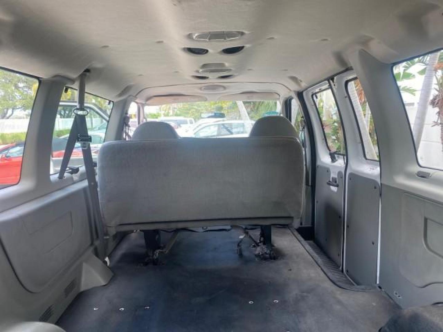 2005 Oxford White /Medium Flint Ford Econoline Wagon 5 PASSENGER XL LOW MILES 49,408 (1FBSS31L05H) with an 5.4L EFI V8 Engine engine, Automatic transmission, located at 4701 North Dixie Hwy, Pompano Beach, FL, 33064, (954) 422-2889, 26.240938, -80.123474 - OUR WEBPAGE FLORIDACARS1.COM HAS OVER 100 PHOTOS AND FREE CARFAX LINK 2005 FORD E-SERIES E-350 SD XLT 5PASSENGER VIN: 1FBSS31L05HA95671 1 F B S S 3 1 L 0 5 H A 9 5 6 7 1 VAN 5.4L V8 F GASOLINE REAR WHEEL DRIVE Top Features Rear Air Conditioning Third Row Seat Vinyl Seats Basic Features ABS Brakes AM - Photo#69