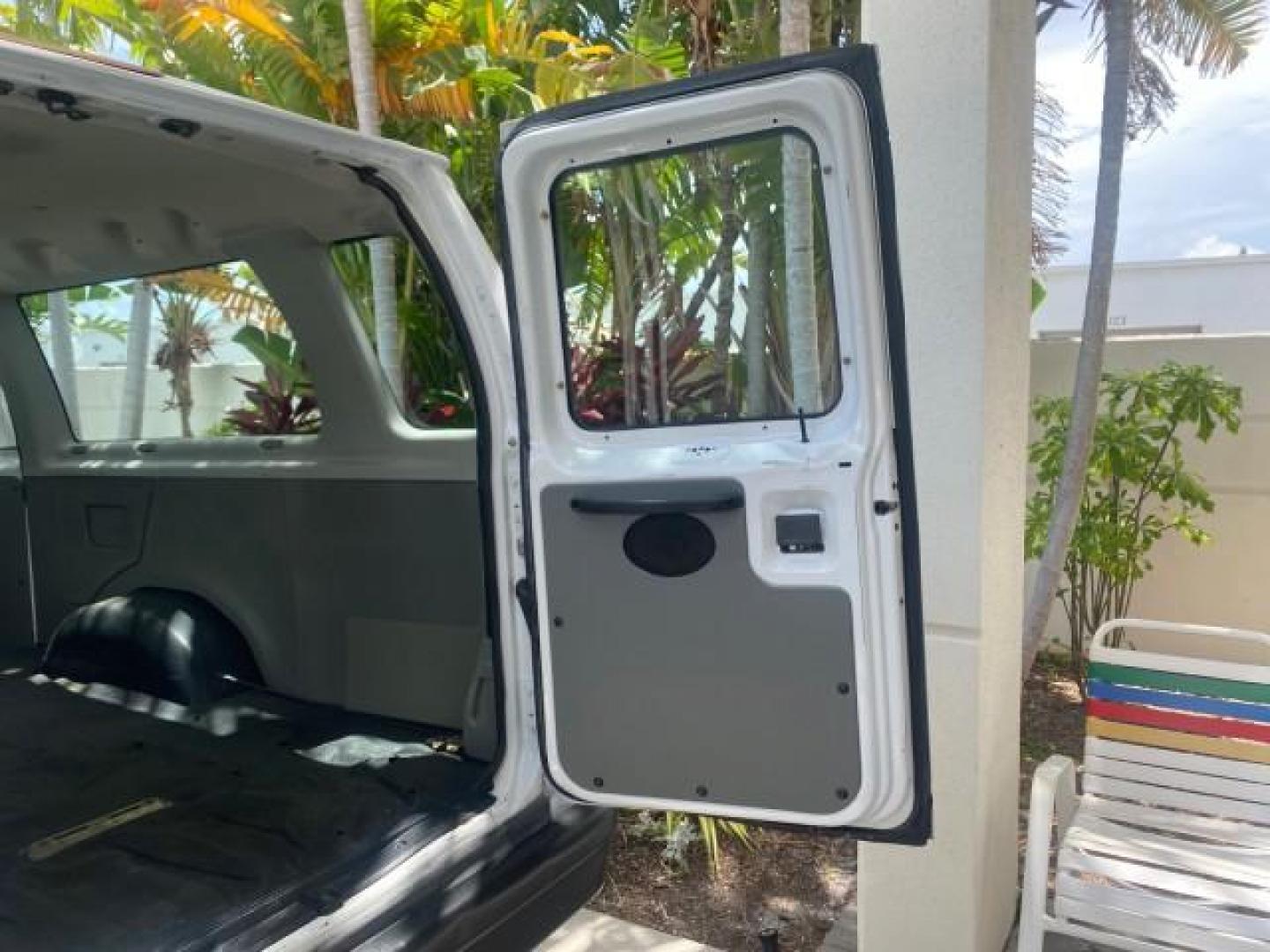 2005 Oxford White /Medium Flint Ford Econoline Wagon 5 PASSENGER XL LOW MILES 49,408 (1FBSS31L05H) with an 5.4L EFI V8 Engine engine, Automatic transmission, located at 4701 North Dixie Hwy, Pompano Beach, FL, 33064, (954) 422-2889, 26.240938, -80.123474 - OUR WEBPAGE FLORIDACARS1.COM HAS OVER 100 PHOTOS AND FREE CARFAX LINK 2005 FORD E-SERIES E-350 SD XLT 5PASSENGER VIN: 1FBSS31L05HA95671 1 F B S S 3 1 L 0 5 H A 9 5 6 7 1 VAN 5.4L V8 F GASOLINE REAR WHEEL DRIVE Top Features Rear Air Conditioning Third Row Seat Vinyl Seats Basic Features ABS Brakes AM - Photo#85