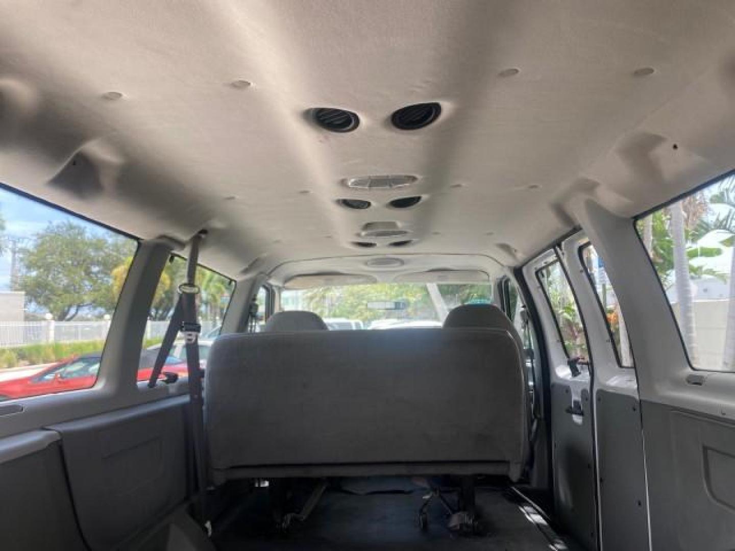 2005 Oxford White /Medium Flint Ford Econoline Wagon 5 PASSENGER XL LOW MILES 49,408 (1FBSS31L05H) with an 5.4L EFI V8 Engine engine, Automatic transmission, located at 4701 North Dixie Hwy, Pompano Beach, FL, 33064, (954) 422-2889, 26.240938, -80.123474 - OUR WEBPAGE FLORIDACARS1.COM HAS OVER 100 PHOTOS AND FREE CARFAX LINK 2005 FORD E-SERIES E-350 SD XLT 5PASSENGER VIN: 1FBSS31L05HA95671 1 F B S S 3 1 L 0 5 H A 9 5 6 7 1 VAN 5.4L V8 F GASOLINE REAR WHEEL DRIVE Top Features Rear Air Conditioning Third Row Seat Vinyl Seats Basic Features ABS Brakes AM - Photo#88