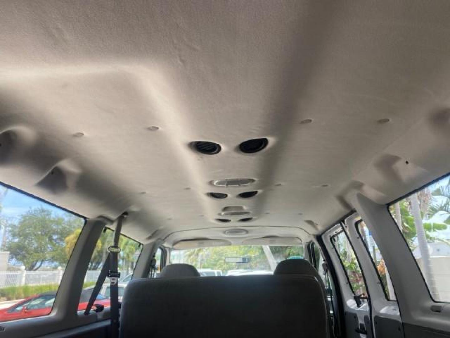 2005 Oxford White /Medium Flint Ford Econoline Wagon 5 PASSENGER XL LOW MILES 49,408 (1FBSS31L05H) with an 5.4L EFI V8 Engine engine, Automatic transmission, located at 4701 North Dixie Hwy, Pompano Beach, FL, 33064, (954) 422-2889, 26.240938, -80.123474 - OUR WEBPAGE FLORIDACARS1.COM HAS OVER 100 PHOTOS AND FREE CARFAX LINK 2005 FORD E-SERIES E-350 SD XLT 5PASSENGER VIN: 1FBSS31L05HA95671 1 F B S S 3 1 L 0 5 H A 9 5 6 7 1 VAN 5.4L V8 F GASOLINE REAR WHEEL DRIVE Top Features Rear Air Conditioning Third Row Seat Vinyl Seats Basic Features ABS Brakes AM - Photo#89