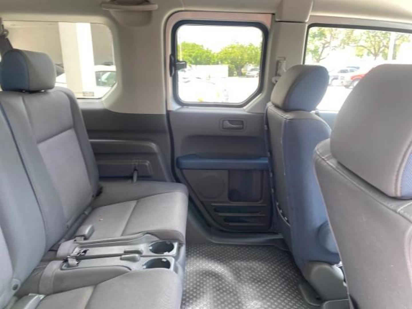 2006 Atomic Blue Metallic /Gray/Blue Honda Element EX LOW MILES 51,488 1 OWNER (5J6YH18666L) with an 2.4L DOHC MPFI 16-Valve i-VTEC I4 Engine engine, Automatic transmission, located at 4701 North Dixie Hwy, Pompano Beach, FL, 33064, (954) 422-2889, 26.240938, -80.123474 - OUR WEBPAGE FLORIDACARS1.COM HAS OVER 100 PHOTOS AND FREE CARFAX LINK 2006 HONDA ELEMENT EX AUTO CHECK 1 OWNER VIN: 5J6YH18666L014478 5 J 6 Y H 1 8 6 6 6 L 0 1 4 4 7 8 4 DOOR WAGON/SPORT UTILITY 2.4L I4 F DOHC 16V GASOLINE FRONT WHEEL DRIVE Top Features Alloy Wheels Bluetooth Technology Cloth Seats - Photo#90
