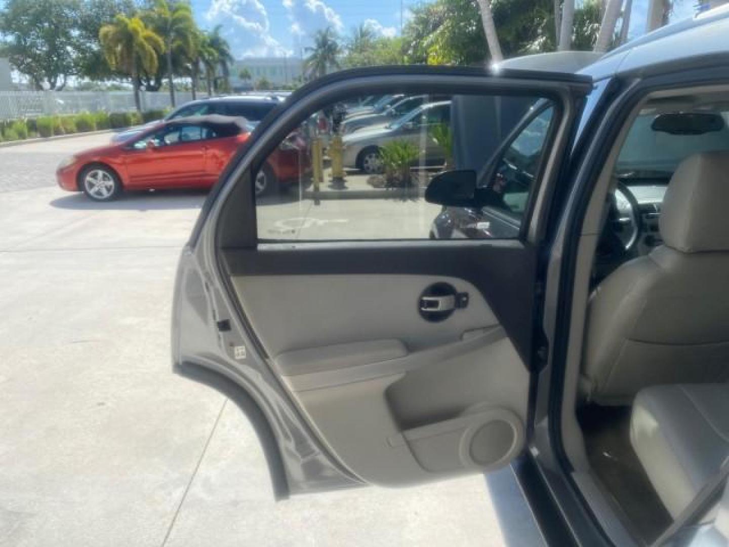 2005 Galaxy Silver Metallic /Light Gray Chevrolet Equinox LT LOW MILES 62,448 (2CNDL63F956) with an 3.4L 3400 V6 Engine engine, Automatic transmission, located at 4701 North Dixie Hwy, Pompano Beach, FL, 33064, (954) 422-2889, 26.240938, -80.123474 - OUR WEBPAGE FLORIDACARS1.COM HAS OVER 100 PHOTOS AND FREE CARFAX LINK 2005 CHEVROLET EQUINOX LT VIN: 2CNDL63F956029471 2 C N D L 6 3 F 9 5 6 0 2 9 4 7 1 4 DOOR WAGON/SPORT UTILITY 3.4L V6 F GASOLINE FRONT WHEEL DRIVE Top Features Alloy Wheels Leather Seats Basic Features ABS Brakes AM/FM Stereo Air - Photo#13