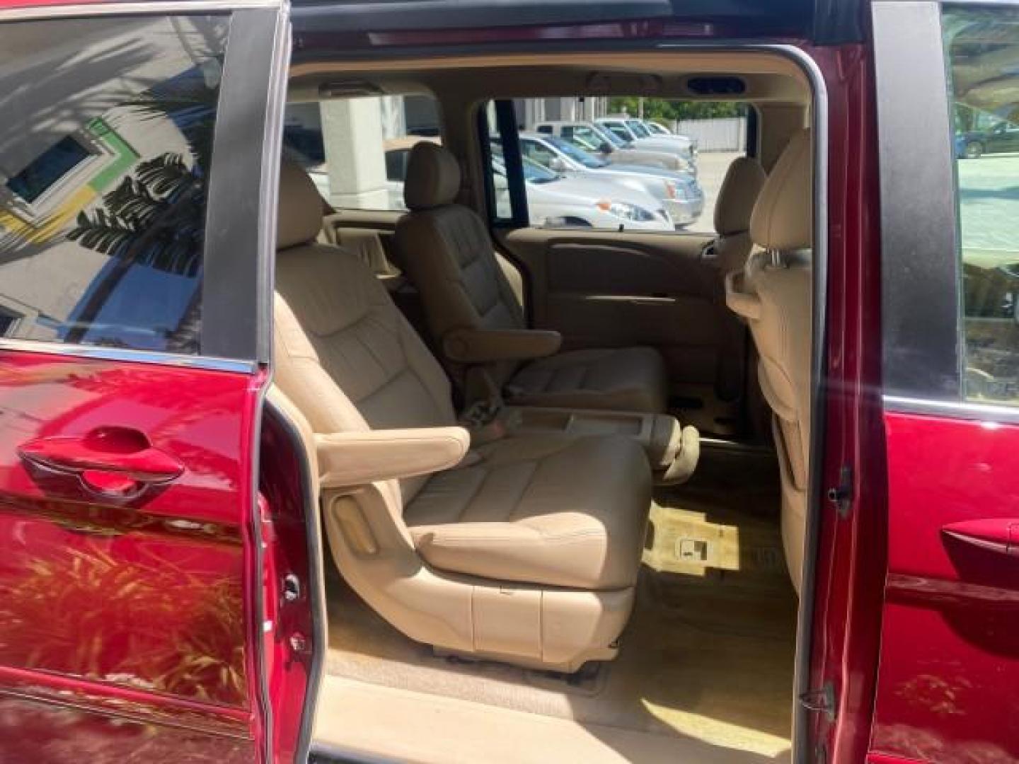 2006 Red Rock Pearl /Ivory Honda Odyssey EX-L 1 OWNER FLORIDA (5FNRL38646B) with an 3.5L SOHC MPFI 24-Valve i-VTEC V6 Engine engine, Automatic transmission, located at 4701 North Dixie Hwy, Pompano Beach, FL, 33064, (954) 422-2889, 26.240938, -80.123474 - OUR WEBPAGE FLORIDACARS1.COM HAS OVER 100 PHOTOS AND FREE CARFAX LINK 2006 HONDA ODYSSEY EX-L VIN: 5FNRL38646B441326 5 F N R L 3 8 6 4 6 B 4 4 1 3 2 6 VAN 3.5L V6 F SOHC 24V GASOLINE FRONT WHEEL DRIVE Top Features Alloy Wheels Fold-Away Third Row Front Seat Heaters Leather Seats Quad Seats Rear Air - Photo#88