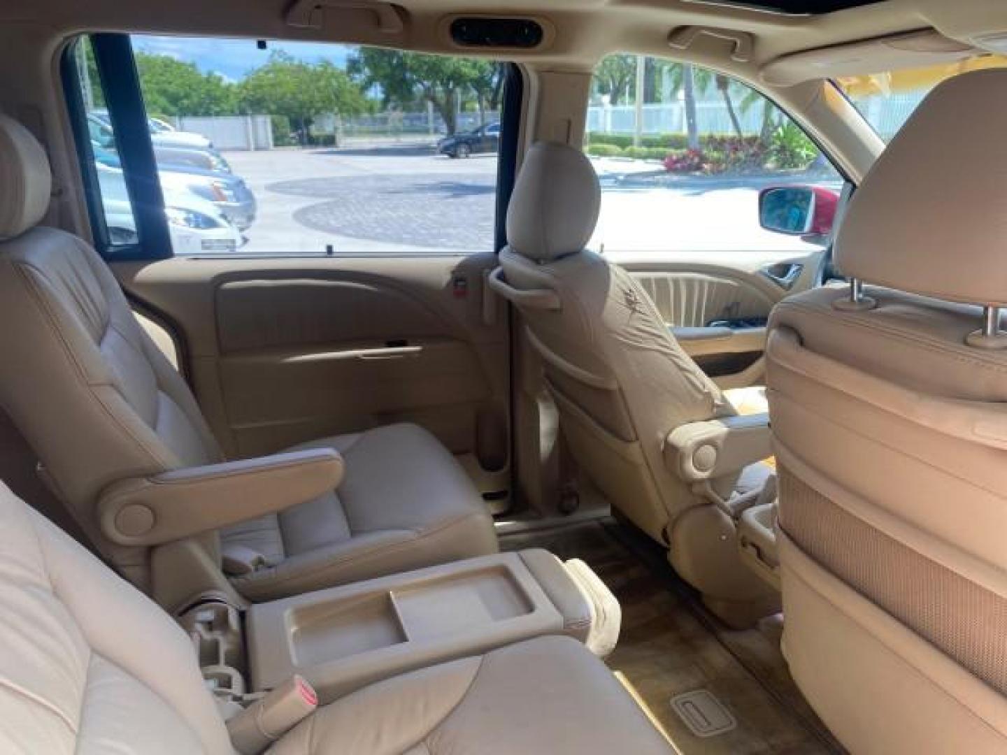 2006 Red Rock Pearl /Ivory Honda Odyssey EX-L 1 OWNER FLORIDA (5FNRL38646B) with an 3.5L SOHC MPFI 24-Valve i-VTEC V6 Engine engine, Automatic transmission, located at 4701 North Dixie Hwy, Pompano Beach, FL, 33064, (954) 422-2889, 26.240938, -80.123474 - OUR WEBPAGE FLORIDACARS1.COM HAS OVER 100 PHOTOS AND FREE CARFAX LINK 2006 HONDA ODYSSEY EX-L VIN: 5FNRL38646B441326 5 F N R L 3 8 6 4 6 B 4 4 1 3 2 6 VAN 3.5L V6 F SOHC 24V GASOLINE FRONT WHEEL DRIVE Top Features Alloy Wheels Fold-Away Third Row Front Seat Heaters Leather Seats Quad Seats Rear Air - Photo#91