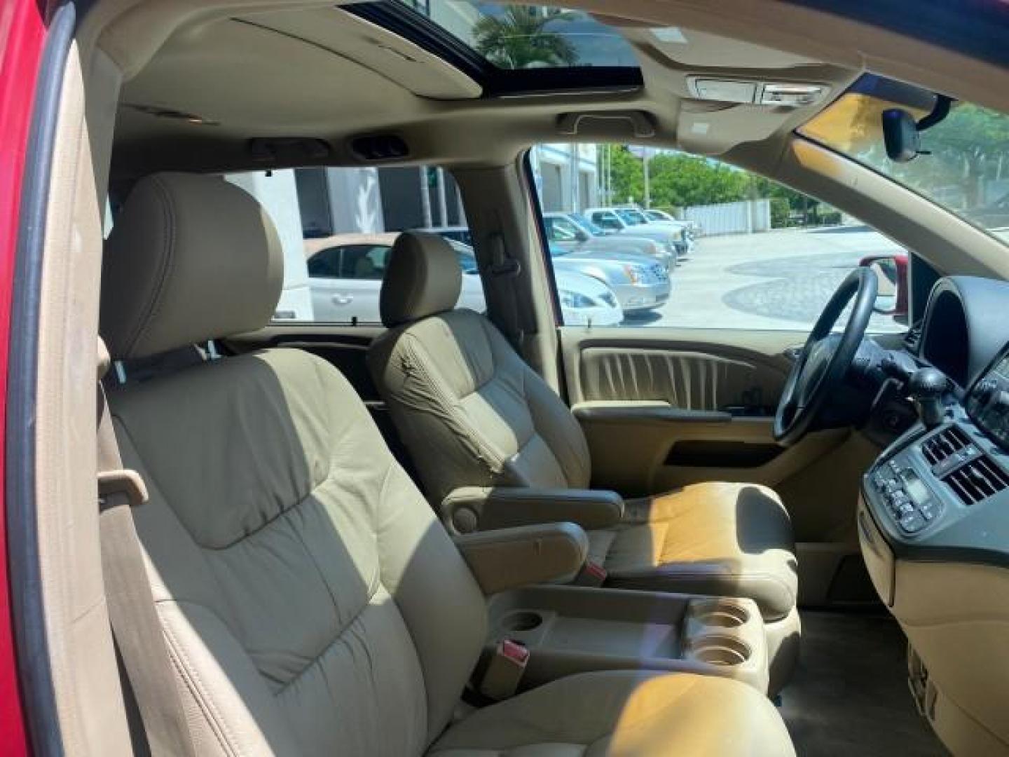 2006 Red Rock Pearl /Ivory Honda Odyssey EX-L 1 OWNER FLORIDA (5FNRL38646B) with an 3.5L SOHC MPFI 24-Valve i-VTEC V6 Engine engine, Automatic transmission, located at 4701 North Dixie Hwy, Pompano Beach, FL, 33064, (954) 422-2889, 26.240938, -80.123474 - OUR WEBPAGE FLORIDACARS1.COM HAS OVER 100 PHOTOS AND FREE CARFAX LINK 2006 HONDA ODYSSEY EX-L VIN: 5FNRL38646B441326 5 F N R L 3 8 6 4 6 B 4 4 1 3 2 6 VAN 3.5L V6 F SOHC 24V GASOLINE FRONT WHEEL DRIVE Top Features Alloy Wheels Fold-Away Third Row Front Seat Heaters Leather Seats Quad Seats Rear Air - Photo#96