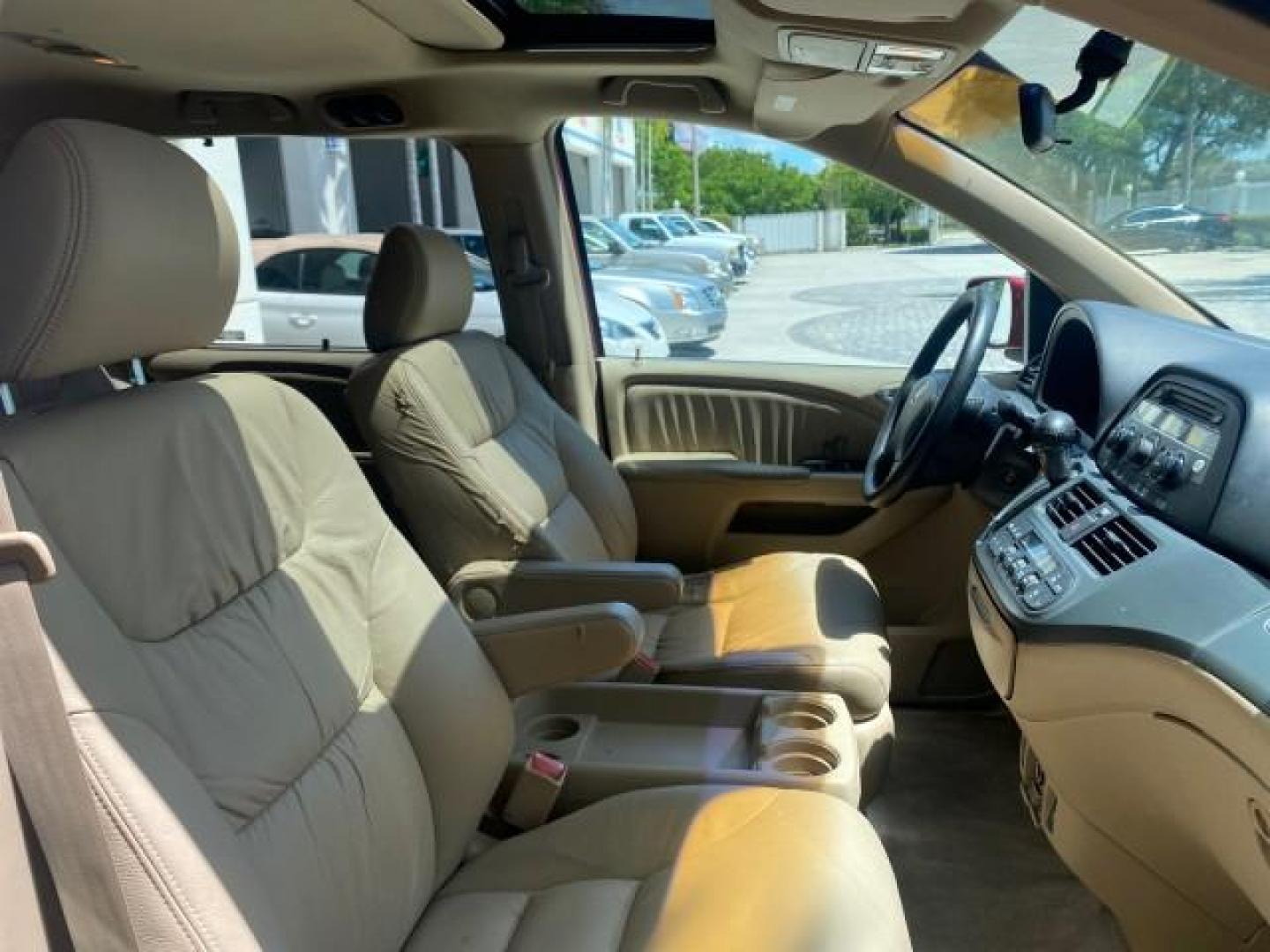 2006 Red Rock Pearl /Ivory Honda Odyssey EX-L 1 OWNER FLORIDA (5FNRL38646B) with an 3.5L SOHC MPFI 24-Valve i-VTEC V6 Engine engine, Automatic transmission, located at 4701 North Dixie Hwy, Pompano Beach, FL, 33064, (954) 422-2889, 26.240938, -80.123474 - OUR WEBPAGE FLORIDACARS1.COM HAS OVER 100 PHOTOS AND FREE CARFAX LINK 2006 HONDA ODYSSEY EX-L VIN: 5FNRL38646B441326 5 F N R L 3 8 6 4 6 B 4 4 1 3 2 6 VAN 3.5L V6 F SOHC 24V GASOLINE FRONT WHEEL DRIVE Top Features Alloy Wheels Fold-Away Third Row Front Seat Heaters Leather Seats Quad Seats Rear Air - Photo#97