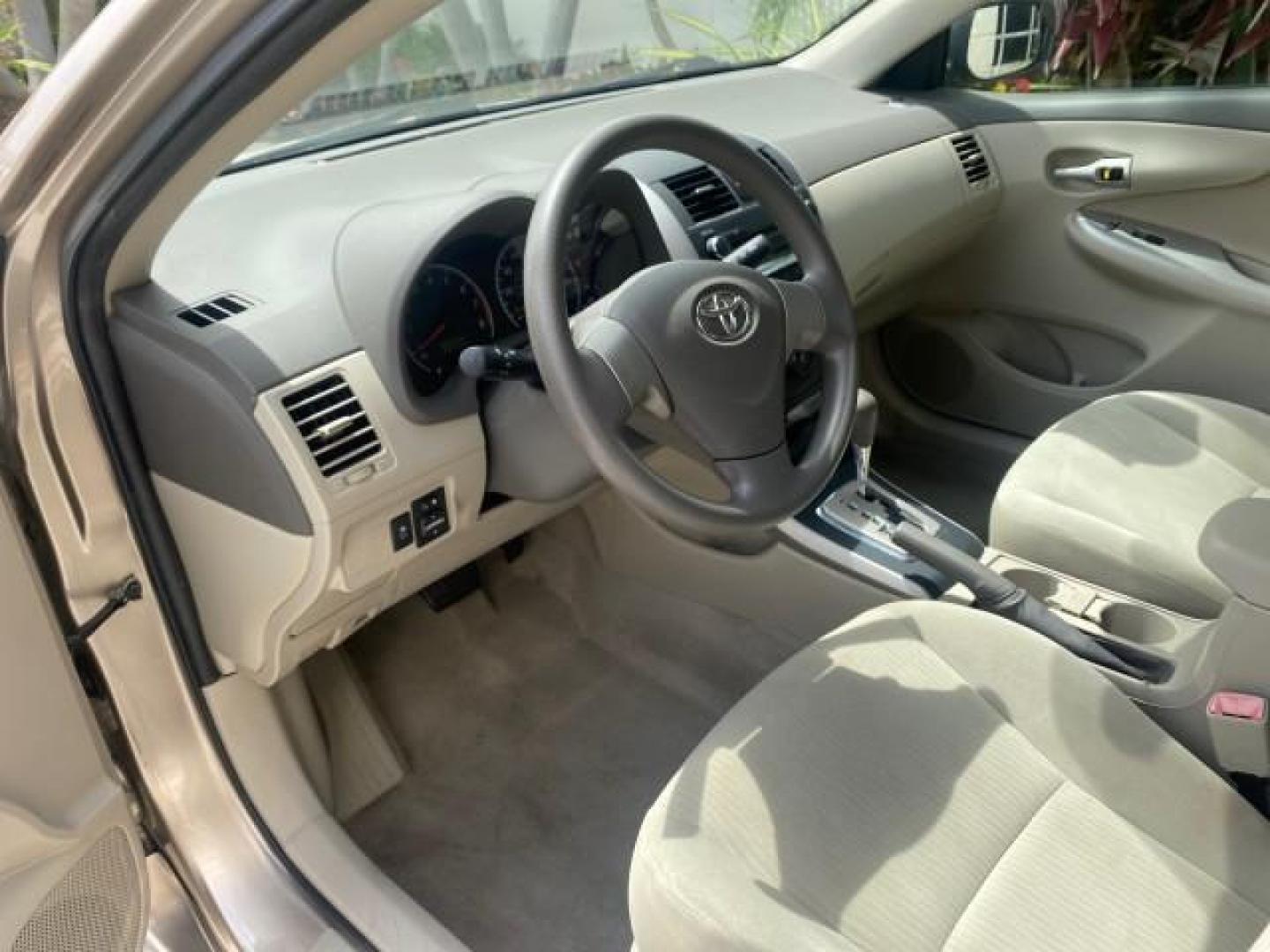 2010 Desert Sand Mica /Bisque Toyota Corolla LE LOW MILES 37,834 (1NXBU4EE1AZ) with an 1.8L DOHC SFI 16-Valve VVT-i 4-Cyl Engine engine, Automatic transmission, located at 4701 North Dixie Hwy, Pompano Beach, FL, 33064, (954) 422-2889, 26.240938, -80.123474 - OUR WEBPAGE FLORIDACARS1.COM HAS OVER 100 PHOTOS AND FREE CARFAX LINK 2010 TOYOTA COROLLA LE 35 mpg VIN: 1NXBU4EE1AZ270742 1 N X B U 4 E E 1 A Z 2 7 0 7 4 2 SEDAN 4 DR 1.8L I4 F DOHC 16V GASOLINE FRONT WHEEL DRIVE Top Features Cloth Seats Satellite Radio Ready Basic Features ABS Brakes AM/FM Stereo - Photo#36