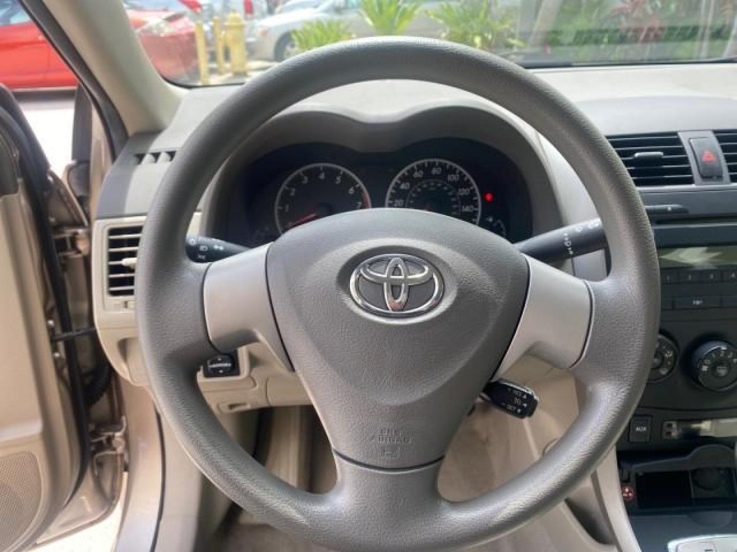 2010 Desert Sand Mica /Bisque Toyota Corolla LE LOW MILES 37,834 (1NXBU4EE1AZ) with an 1.8L DOHC SFI 16-Valve VVT-i 4-Cyl Engine engine, Automatic transmission, located at 4701 North Dixie Hwy, Pompano Beach, FL, 33064, (954) 422-2889, 26.240938, -80.123474 - OUR WEBPAGE FLORIDACARS1.COM HAS OVER 100 PHOTOS AND FREE CARFAX LINK 2010 TOYOTA COROLLA LE 35 mpg VIN: 1NXBU4EE1AZ270742 1 N X B U 4 E E 1 A Z 2 7 0 7 4 2 SEDAN 4 DR 1.8L I4 F DOHC 16V GASOLINE FRONT WHEEL DRIVE Top Features Cloth Seats Satellite Radio Ready Basic Features ABS Brakes AM/FM Stereo - Photo#37
