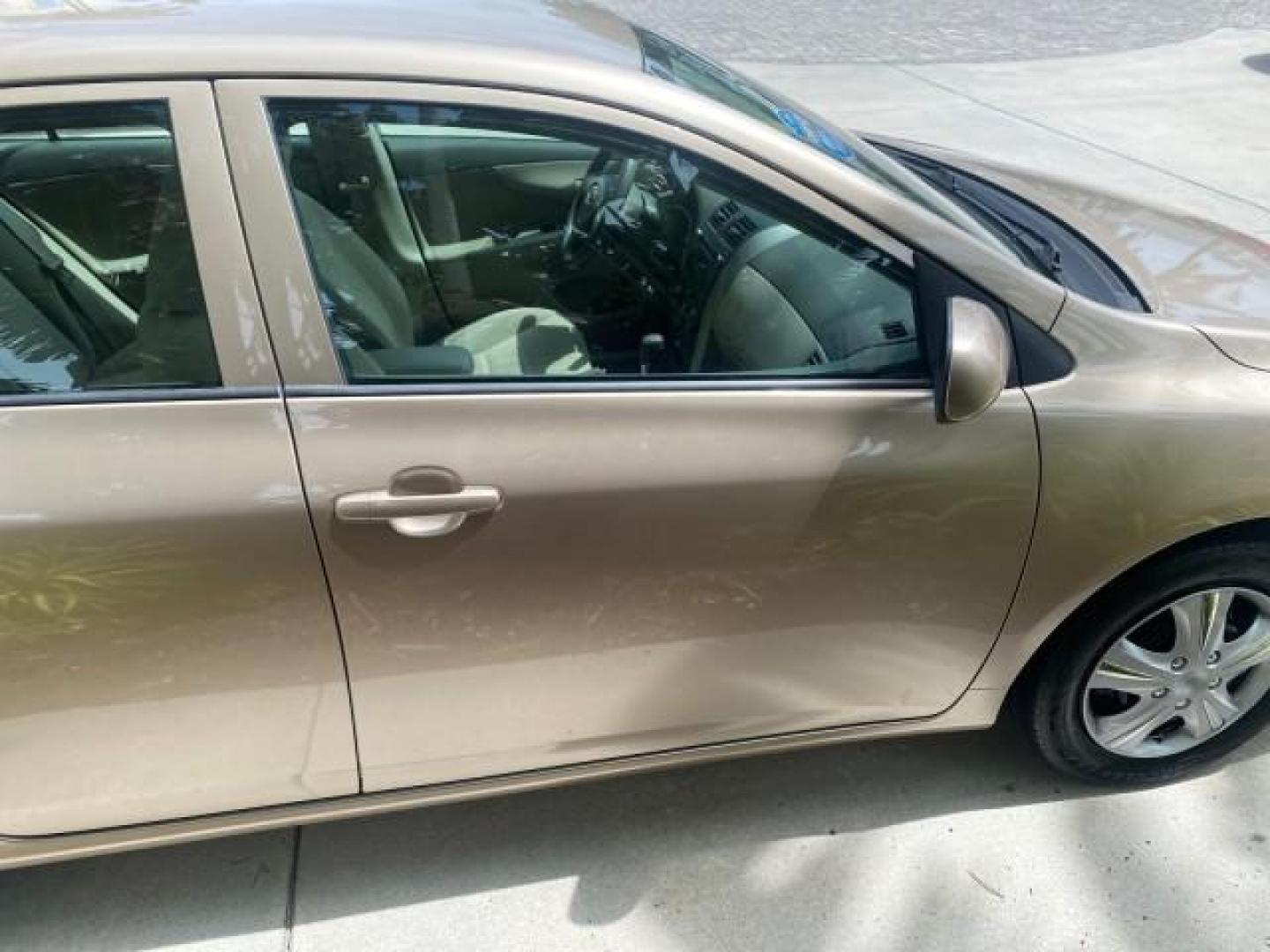 2010 Desert Sand Mica /Bisque Toyota Corolla LE LOW MILES 37,834 (1NXBU4EE1AZ) with an 1.8L DOHC SFI 16-Valve VVT-i 4-Cyl Engine engine, Automatic transmission, located at 4701 North Dixie Hwy, Pompano Beach, FL, 33064, (954) 422-2889, 26.240938, -80.123474 - OUR WEBPAGE FLORIDACARS1.COM HAS OVER 100 PHOTOS AND FREE CARFAX LINK 2010 TOYOTA COROLLA LE 35 mpg VIN: 1NXBU4EE1AZ270742 1 N X B U 4 E E 1 A Z 2 7 0 7 4 2 SEDAN 4 DR 1.8L I4 F DOHC 16V GASOLINE FRONT WHEEL DRIVE Top Features Cloth Seats Satellite Radio Ready Basic Features ABS Brakes AM/FM Stereo - Photo#99