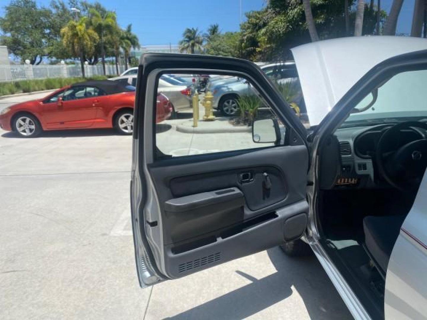 2002 Just Blue Metallic /Gray Nissan Frontier 2WD XE XCAB 5 SPD AC 4 CYL (1N6DD26S42C) with an 2.4L DOHC SMPI 16-Valve 4-Cyl Engine engine, Manual transmission, located at 4701 North Dixie Hwy, Pompano Beach, FL, 33064, (954) 422-2889, 26.240938, -80.123474 - OUR WEBPAGE FLORIDACARS1.COM HAS OVER 100 PHOTOS AND FREE CARFAX LINK 2002 NISSAN FRONTIER XE 4 CYL 5 SPD VIN: 1N6DD26S42C374720 1 N 6 D D 2 6 S 4 2 C 3 7 4 7 2 0 CLUB CAB PICKUP 2.4L I4 F DOHC 16V GASOLINE REAR WHEEL DRIVE Top Features Alloy Wheels Bed Liner Cloth Seats Tow Hitch Basic Features ABS - Photo#9
