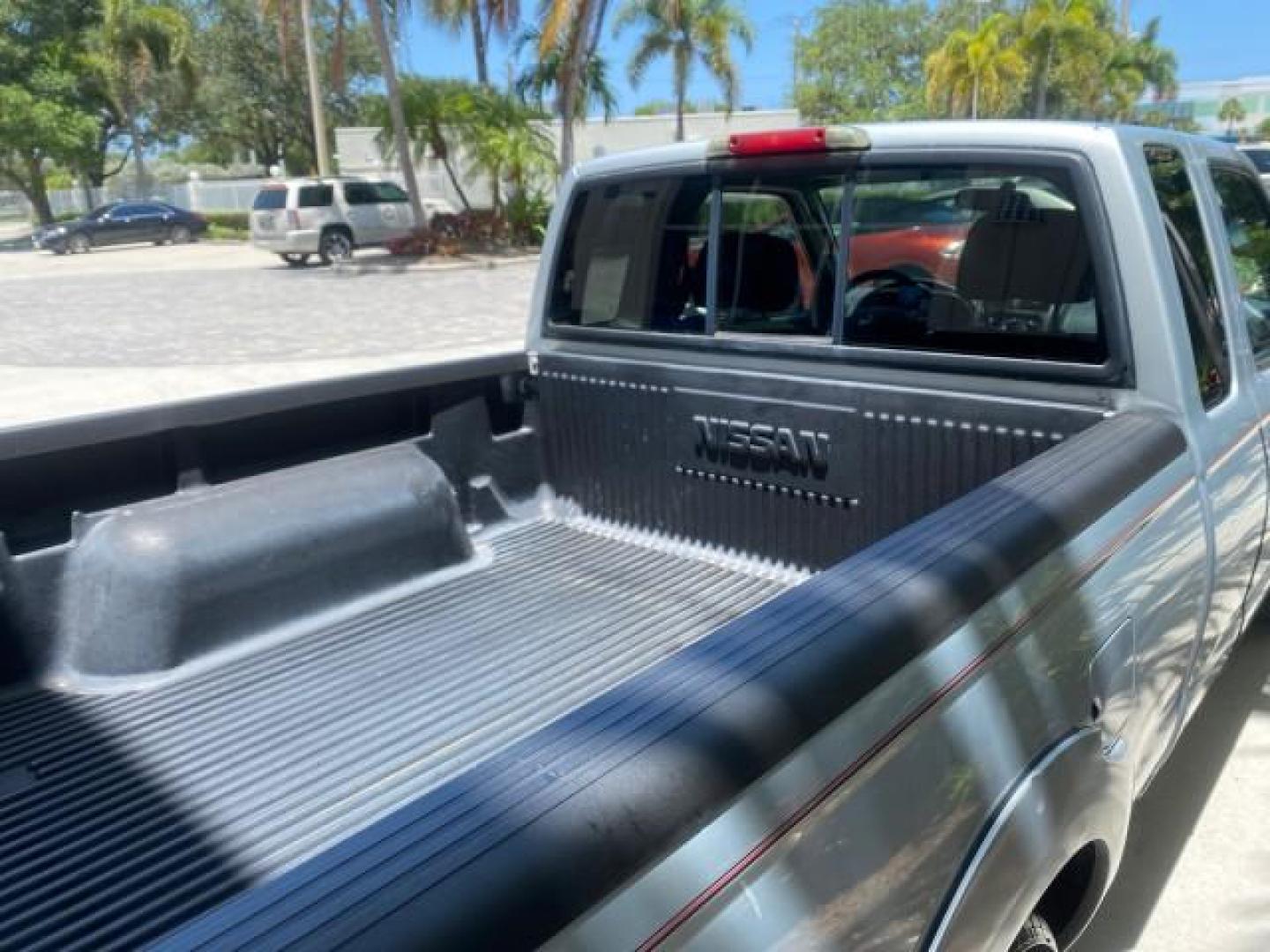 2002 Just Blue Metallic /Gray Nissan Frontier 2WD XE XCAB 5 SPD AC 4 CYL (1N6DD26S42C) with an 2.4L DOHC SMPI 16-Valve 4-Cyl Engine engine, Manual transmission, located at 4701 North Dixie Hwy, Pompano Beach, FL, 33064, (954) 422-2889, 26.240938, -80.123474 - OUR WEBPAGE FLORIDACARS1.COM HAS OVER 100 PHOTOS AND FREE CARFAX LINK 2002 NISSAN FRONTIER XE 4 CYL 5 SPD VIN: 1N6DD26S42C374720 1 N 6 D D 2 6 S 4 2 C 3 7 4 7 2 0 CLUB CAB PICKUP 2.4L I4 F DOHC 16V GASOLINE REAR WHEEL DRIVE Top Features Alloy Wheels Bed Liner Cloth Seats Tow Hitch Basic Features ABS - Photo#82