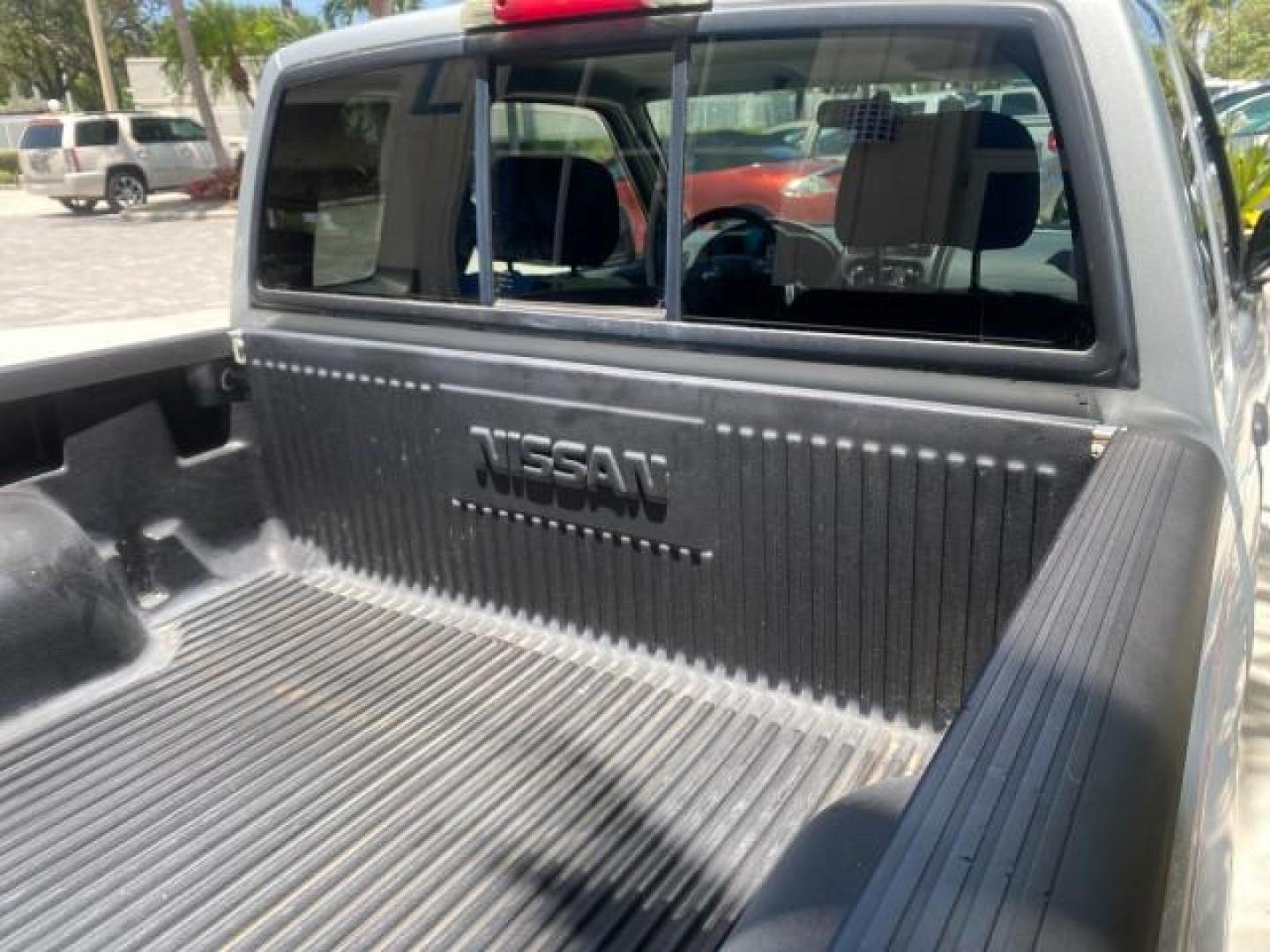 2002 Just Blue Metallic /Gray Nissan Frontier 2WD XE XCAB 5 SPD AC 4 CYL (1N6DD26S42C) with an 2.4L DOHC SMPI 16-Valve 4-Cyl Engine engine, Manual transmission, located at 4701 North Dixie Hwy, Pompano Beach, FL, 33064, (954) 422-2889, 26.240938, -80.123474 - OUR WEBPAGE FLORIDACARS1.COM HAS OVER 100 PHOTOS AND FREE CARFAX LINK 2002 NISSAN FRONTIER XE 4 CYL 5 SPD VIN: 1N6DD26S42C374720 1 N 6 D D 2 6 S 4 2 C 3 7 4 7 2 0 CLUB CAB PICKUP 2.4L I4 F DOHC 16V GASOLINE REAR WHEEL DRIVE Top Features Alloy Wheels Bed Liner Cloth Seats Tow Hitch Basic Features ABS - Photo#83