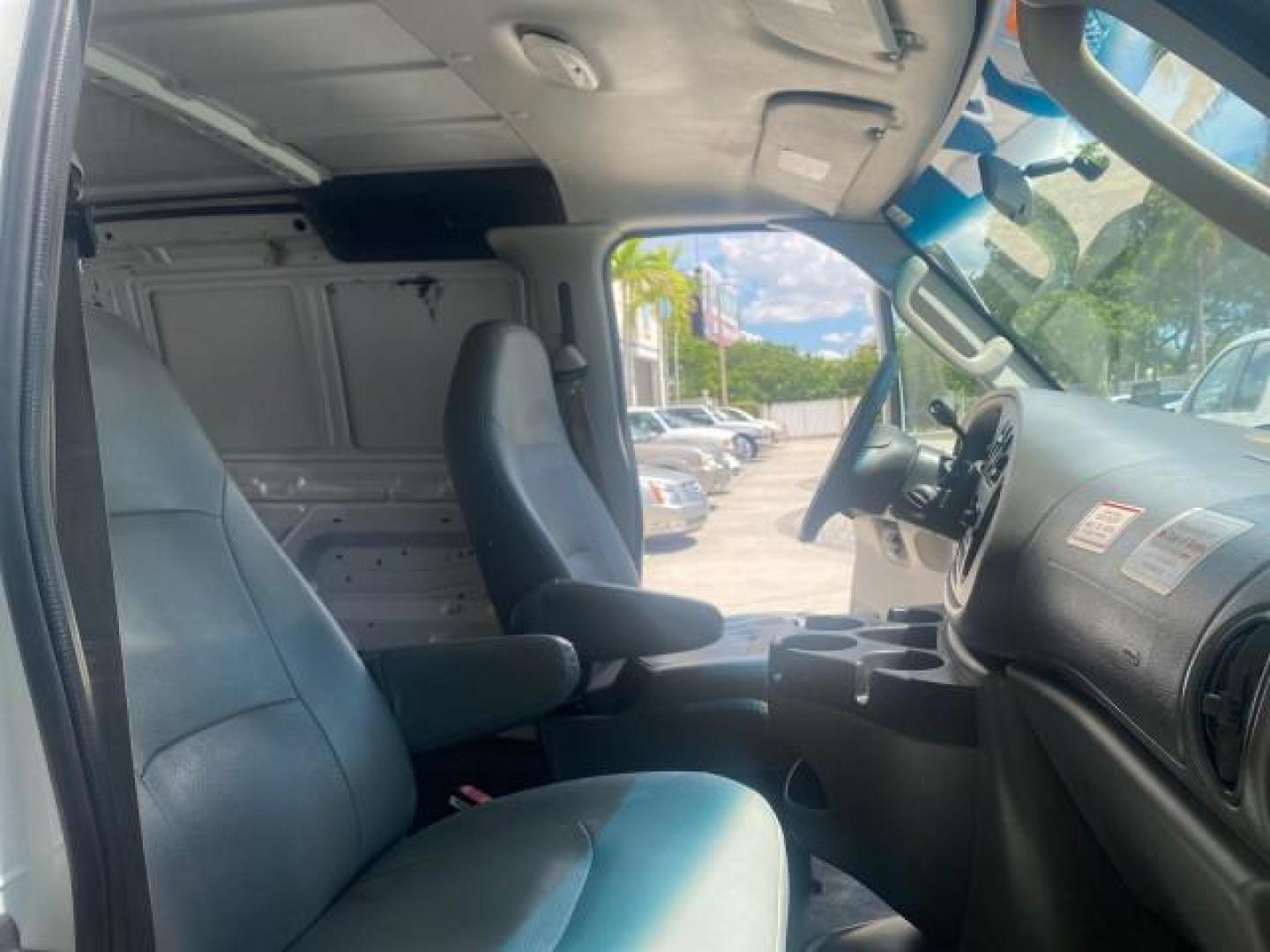 2006 Oxford White /Medium Flint Ford Econoline Cargo Van E350 LOW MILES 66,160 (1FTSE34L56D) with an 5.4L SOHC EFI V8 Triton Engine engine, Automatic transmission, located at 4701 North Dixie Hwy, Pompano Beach, FL, 33064, (954) 422-2889, 26.240938, -80.123474 - OUR WEBPAGE FLORIDACARS1.COM HAS OVER 100 PHOTOS AND FREE CARFAX LINK 2006 FORD E-SERIES E-350 SD CARGO VIN: 1FTSE34L56DB06011 1 F T S E 3 4 L 5 6 D B 0 6 0 1 1 VAN 5.4L V8 F GASOLINE REAR WHEEL DRIVE Top Features Vinyl Seats Basic Features ABS Brakes AM/FM Stereo Air Conditioning Automatic Transmis - Photo#12