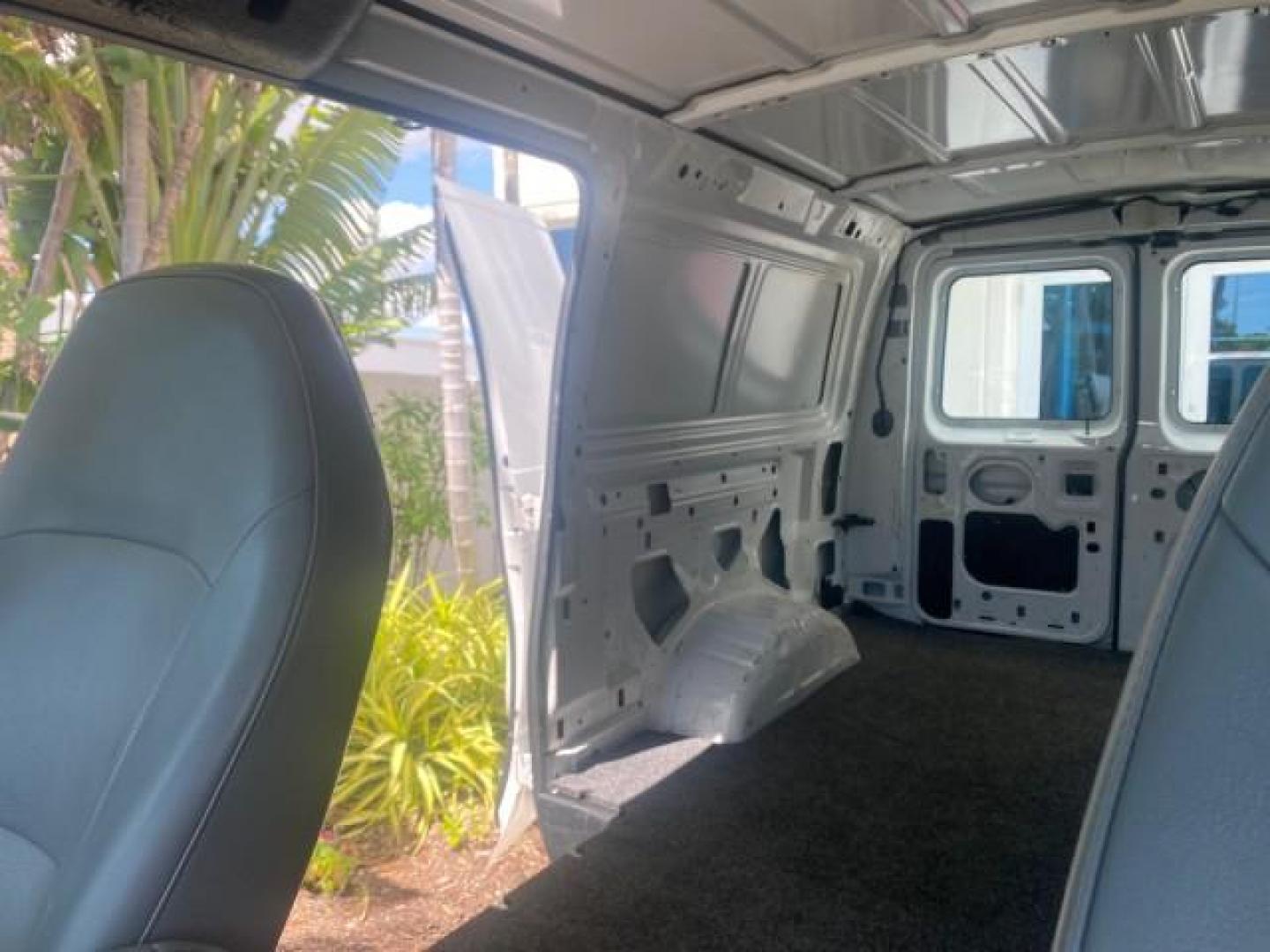 2006 Oxford White /Medium Flint Ford Econoline Cargo Van E350 LOW MILES 66,160 (1FTSE34L56D) with an 5.4L SOHC EFI V8 Triton Engine engine, Automatic transmission, located at 4701 North Dixie Hwy, Pompano Beach, FL, 33064, (954) 422-2889, 26.240938, -80.123474 - OUR WEBPAGE FLORIDACARS1.COM HAS OVER 100 PHOTOS AND FREE CARFAX LINK 2006 FORD E-SERIES E-350 SD CARGO VIN: 1FTSE34L56DB06011 1 F T S E 3 4 L 5 6 D B 0 6 0 1 1 VAN 5.4L V8 F GASOLINE REAR WHEEL DRIVE Top Features Vinyl Seats Basic Features ABS Brakes AM/FM Stereo Air Conditioning Automatic Transmis - Photo#56