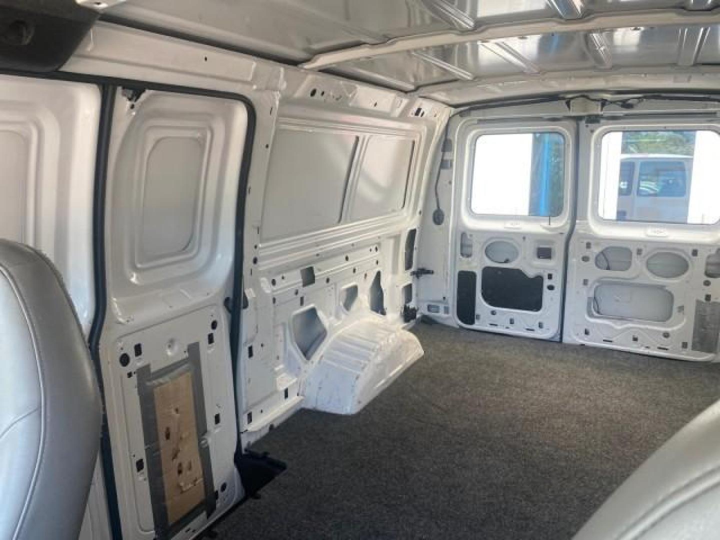 2006 Oxford White /Medium Flint Ford Econoline Cargo Van E350 LOW MILES 66,160 (1FTSE34L56D) with an 5.4L SOHC EFI V8 Triton Engine engine, Automatic transmission, located at 4701 North Dixie Hwy, Pompano Beach, FL, 33064, (954) 422-2889, 26.240938, -80.123474 - OUR WEBPAGE FLORIDACARS1.COM HAS OVER 100 PHOTOS AND FREE CARFAX LINK 2006 FORD E-SERIES E-350 SD CARGO VIN: 1FTSE34L56DB06011 1 F T S E 3 4 L 5 6 D B 0 6 0 1 1 VAN 5.4L V8 F GASOLINE REAR WHEEL DRIVE Top Features Vinyl Seats Basic Features ABS Brakes AM/FM Stereo Air Conditioning Automatic Transmis - Photo#58