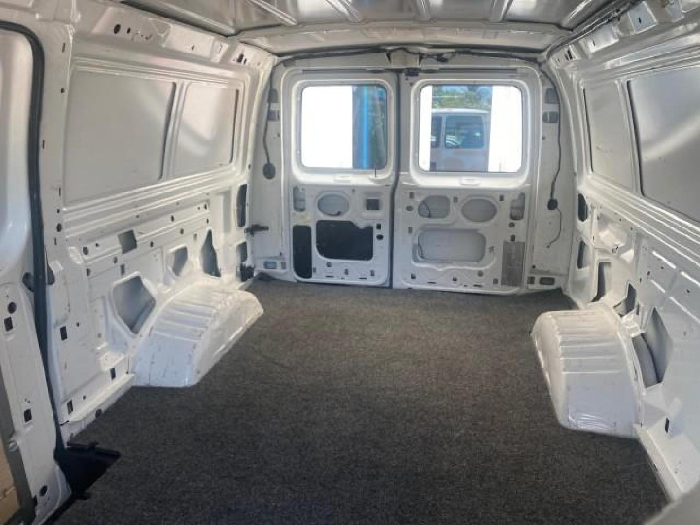 2006 Oxford White /Medium Flint Ford Econoline Cargo Van E350 LOW MILES 66,160 (1FTSE34L56D) with an 5.4L SOHC EFI V8 Triton Engine engine, Automatic transmission, located at 4701 North Dixie Hwy, Pompano Beach, FL, 33064, (954) 422-2889, 26.240938, -80.123474 - OUR WEBPAGE FLORIDACARS1.COM HAS OVER 100 PHOTOS AND FREE CARFAX LINK 2006 FORD E-SERIES E-350 SD CARGO VIN: 1FTSE34L56DB06011 1 F T S E 3 4 L 5 6 D B 0 6 0 1 1 VAN 5.4L V8 F GASOLINE REAR WHEEL DRIVE Top Features Vinyl Seats Basic Features ABS Brakes AM/FM Stereo Air Conditioning Automatic Transmis - Photo#59