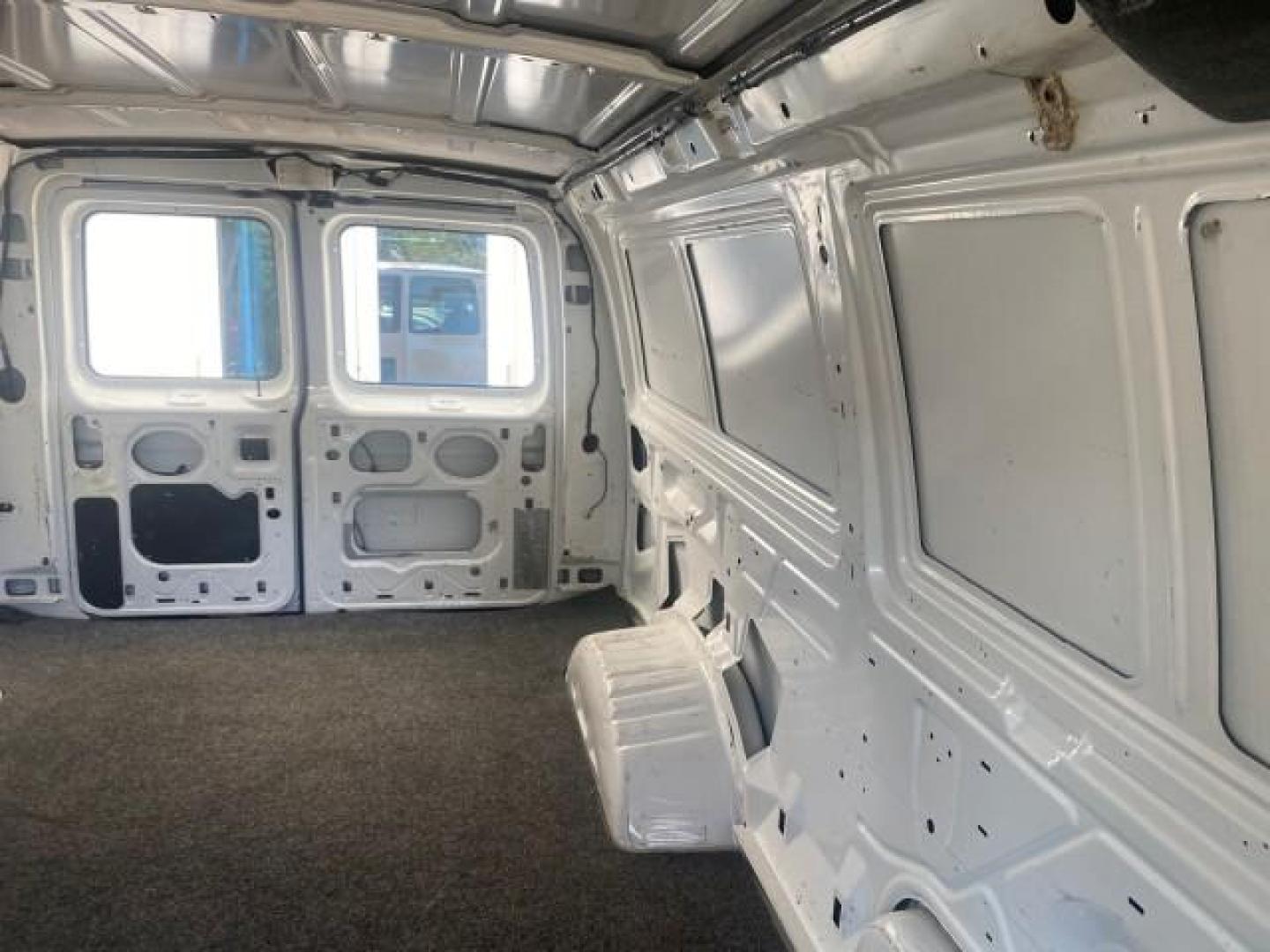 2006 Oxford White /Medium Flint Ford Econoline Cargo Van E350 LOW MILES 66,160 (1FTSE34L56D) with an 5.4L SOHC EFI V8 Triton Engine engine, Automatic transmission, located at 4701 North Dixie Hwy, Pompano Beach, FL, 33064, (954) 422-2889, 26.240938, -80.123474 - OUR WEBPAGE FLORIDACARS1.COM HAS OVER 100 PHOTOS AND FREE CARFAX LINK 2006 FORD E-SERIES E-350 SD CARGO VIN: 1FTSE34L56DB06011 1 F T S E 3 4 L 5 6 D B 0 6 0 1 1 VAN 5.4L V8 F GASOLINE REAR WHEEL DRIVE Top Features Vinyl Seats Basic Features ABS Brakes AM/FM Stereo Air Conditioning Automatic Transmis - Photo#60