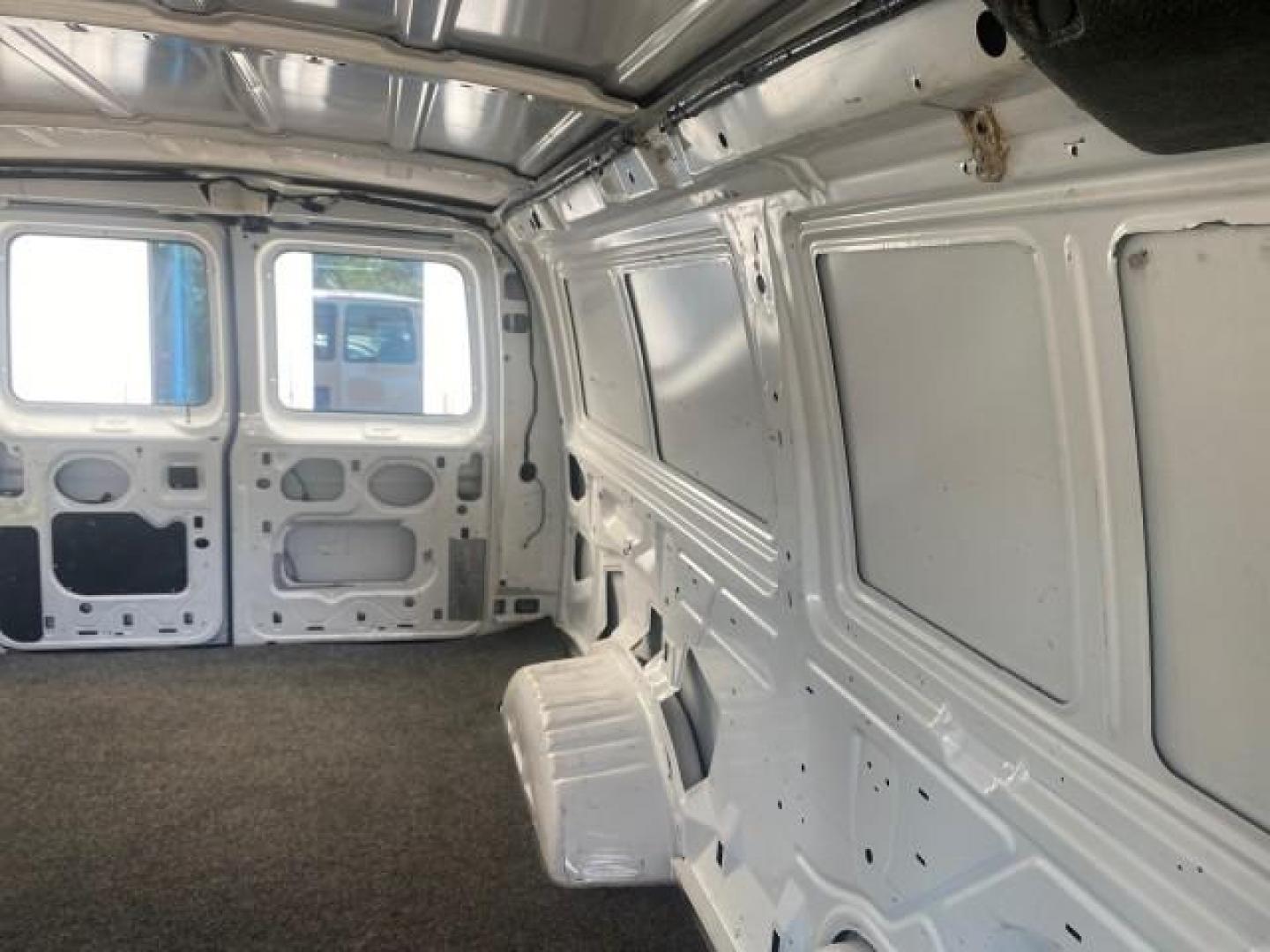 2006 Oxford White /Medium Flint Ford Econoline Cargo Van E350 LOW MILES 66,160 (1FTSE34L56D) with an 5.4L SOHC EFI V8 Triton Engine engine, Automatic transmission, located at 4701 North Dixie Hwy, Pompano Beach, FL, 33064, (954) 422-2889, 26.240938, -80.123474 - OUR WEBPAGE FLORIDACARS1.COM HAS OVER 100 PHOTOS AND FREE CARFAX LINK 2006 FORD E-SERIES E-350 SD CARGO VIN: 1FTSE34L56DB06011 1 F T S E 3 4 L 5 6 D B 0 6 0 1 1 VAN 5.4L V8 F GASOLINE REAR WHEEL DRIVE Top Features Vinyl Seats Basic Features ABS Brakes AM/FM Stereo Air Conditioning Automatic Transmis - Photo#61