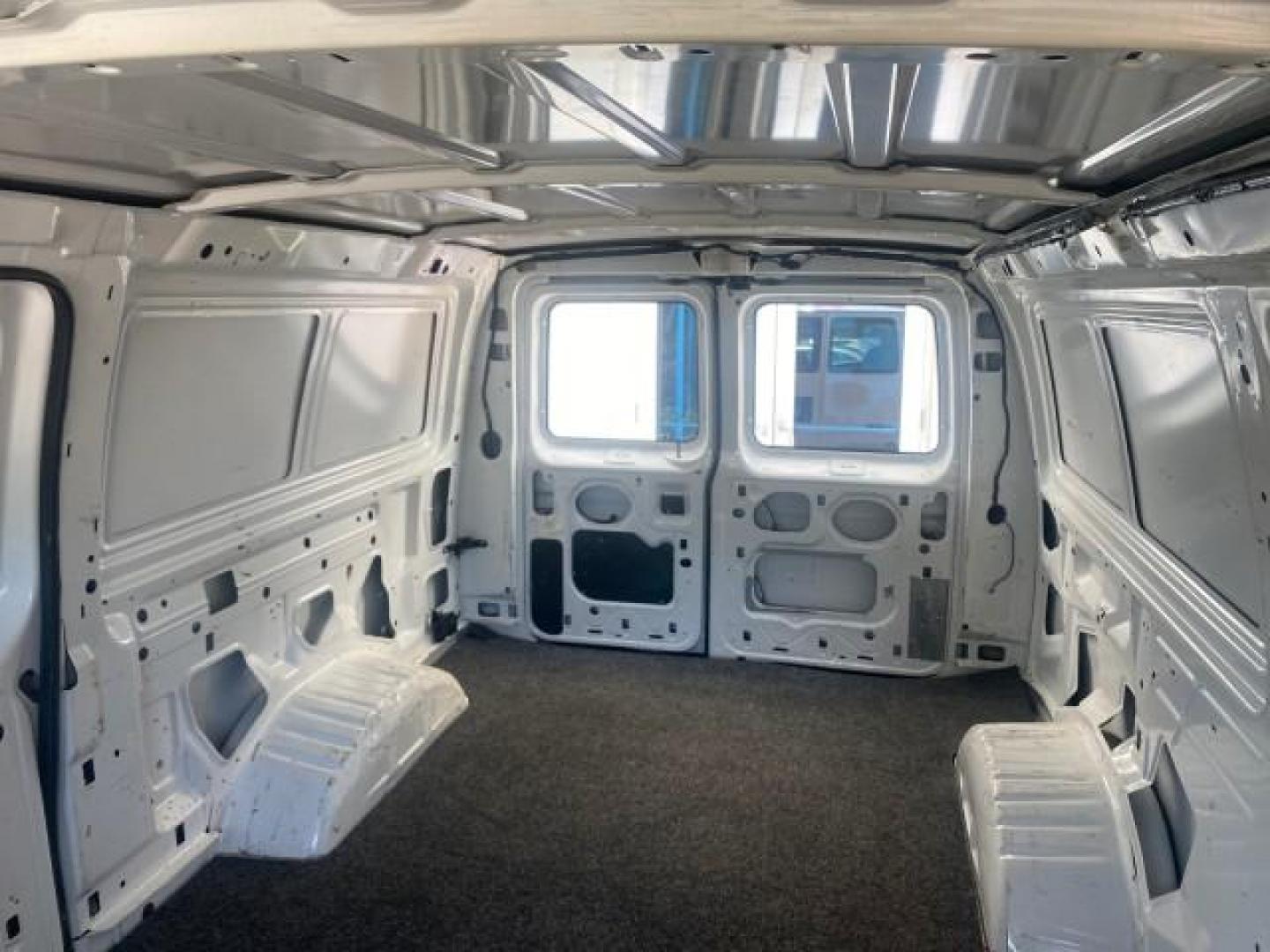 2006 Oxford White /Medium Flint Ford Econoline Cargo Van E350 LOW MILES 66,160 (1FTSE34L56D) with an 5.4L SOHC EFI V8 Triton Engine engine, Automatic transmission, located at 4701 North Dixie Hwy, Pompano Beach, FL, 33064, (954) 422-2889, 26.240938, -80.123474 - OUR WEBPAGE FLORIDACARS1.COM HAS OVER 100 PHOTOS AND FREE CARFAX LINK 2006 FORD E-SERIES E-350 SD CARGO VIN: 1FTSE34L56DB06011 1 F T S E 3 4 L 5 6 D B 0 6 0 1 1 VAN 5.4L V8 F GASOLINE REAR WHEEL DRIVE Top Features Vinyl Seats Basic Features ABS Brakes AM/FM Stereo Air Conditioning Automatic Transmis - Photo#62