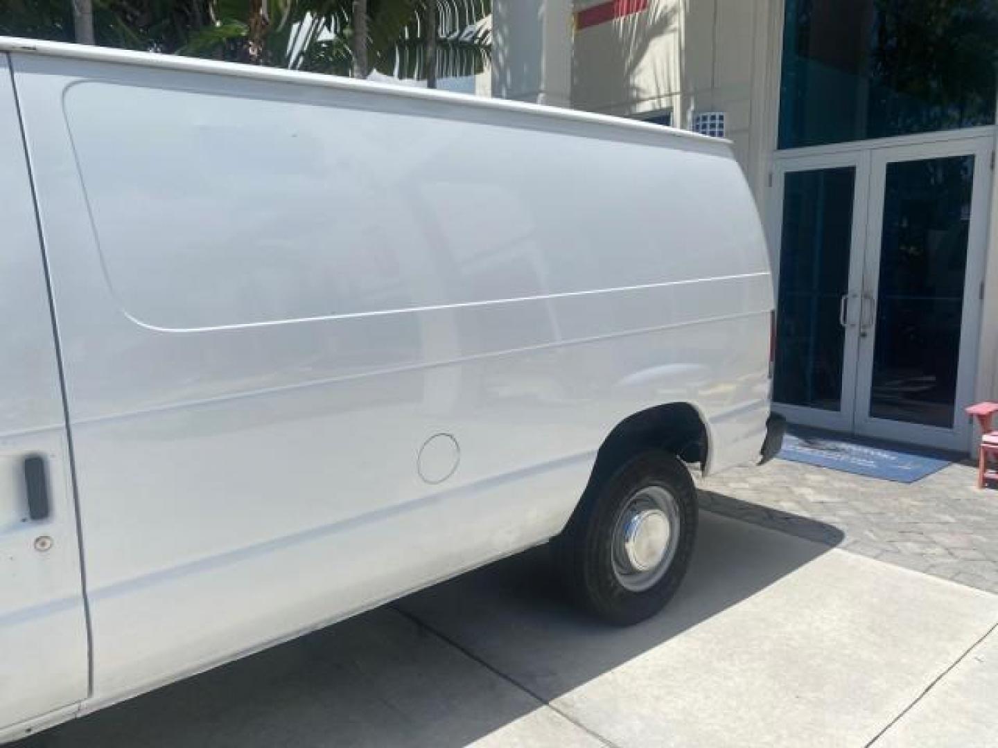 2006 Oxford White /Medium Flint Ford Econoline Cargo Van E350 LOW MILES 66,160 (1FTSE34L56D) with an 5.4L SOHC EFI V8 Triton Engine engine, Automatic transmission, located at 4701 North Dixie Hwy, Pompano Beach, FL, 33064, (954) 422-2889, 26.240938, -80.123474 - OUR WEBPAGE FLORIDACARS1.COM HAS OVER 100 PHOTOS AND FREE CARFAX LINK 2006 FORD E-SERIES E-350 SD CARGO VIN: 1FTSE34L56DB06011 1 F T S E 3 4 L 5 6 D B 0 6 0 1 1 VAN 5.4L V8 F GASOLINE REAR WHEEL DRIVE Top Features Vinyl Seats Basic Features ABS Brakes AM/FM Stereo Air Conditioning Automatic Transmis - Photo#63