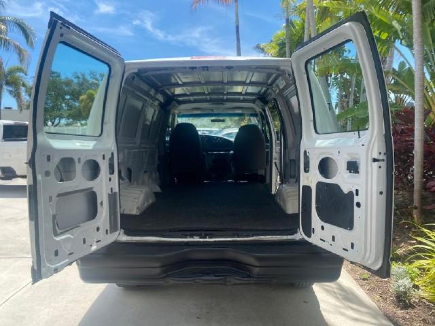 2006 Oxford White /Medium Flint Ford Econoline Cargo Van E350 LOW MILES 66,160 (1FTSE34L56D) with an 5.4L SOHC EFI V8 Triton Engine engine, Automatic transmission, located at 4701 North Dixie Hwy, Pompano Beach, FL, 33064, (954) 422-2889, 26.240938, -80.123474 - OUR WEBPAGE FLORIDACARS1.COM HAS OVER 100 PHOTOS AND FREE CARFAX LINK 2006 FORD E-SERIES E-350 SD CARGO VIN: 1FTSE34L56DB06011 1 F T S E 3 4 L 5 6 D B 0 6 0 1 1 VAN 5.4L V8 F GASOLINE REAR WHEEL DRIVE Top Features Vinyl Seats Basic Features ABS Brakes AM/FM Stereo Air Conditioning Automatic Transmis - Photo#73