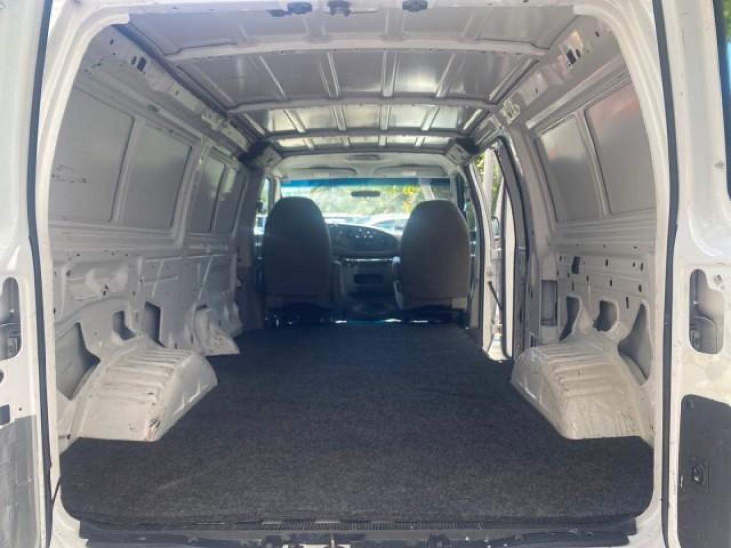 2006 Oxford White /Medium Flint Ford Econoline Cargo Van E350 LOW MILES 66,160 (1FTSE34L56D) with an 5.4L SOHC EFI V8 Triton Engine engine, Automatic transmission, located at 4701 North Dixie Hwy, Pompano Beach, FL, 33064, (954) 422-2889, 26.240938, -80.123474 - OUR WEBPAGE FLORIDACARS1.COM HAS OVER 100 PHOTOS AND FREE CARFAX LINK 2006 FORD E-SERIES E-350 SD CARGO VIN: 1FTSE34L56DB06011 1 F T S E 3 4 L 5 6 D B 0 6 0 1 1 VAN 5.4L V8 F GASOLINE REAR WHEEL DRIVE Top Features Vinyl Seats Basic Features ABS Brakes AM/FM Stereo Air Conditioning Automatic Transmis - Photo#75