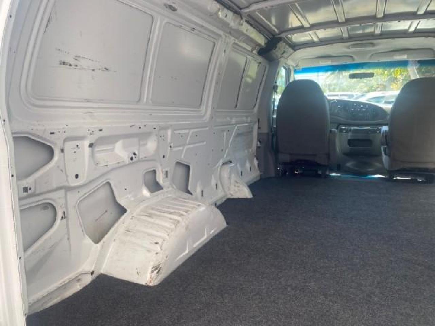 2006 Oxford White /Medium Flint Ford Econoline Cargo Van E350 LOW MILES 66,160 (1FTSE34L56D) with an 5.4L SOHC EFI V8 Triton Engine engine, Automatic transmission, located at 4701 North Dixie Hwy, Pompano Beach, FL, 33064, (954) 422-2889, 26.240938, -80.123474 - OUR WEBPAGE FLORIDACARS1.COM HAS OVER 100 PHOTOS AND FREE CARFAX LINK 2006 FORD E-SERIES E-350 SD CARGO VIN: 1FTSE34L56DB06011 1 F T S E 3 4 L 5 6 D B 0 6 0 1 1 VAN 5.4L V8 F GASOLINE REAR WHEEL DRIVE Top Features Vinyl Seats Basic Features ABS Brakes AM/FM Stereo Air Conditioning Automatic Transmis - Photo#76