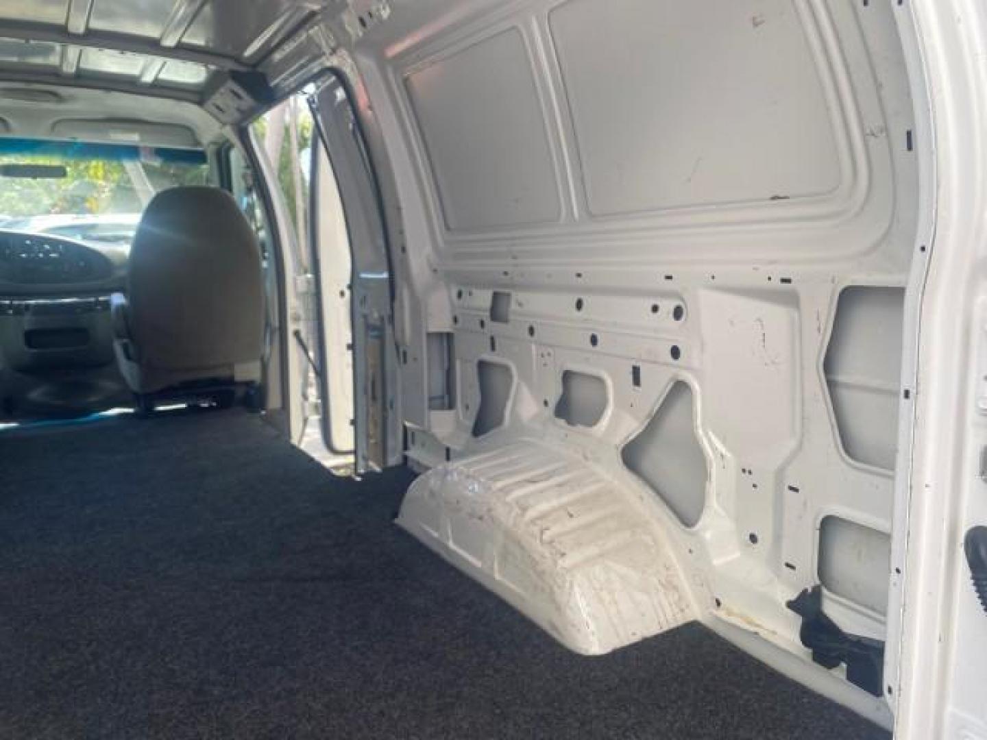2006 Oxford White /Medium Flint Ford Econoline Cargo Van E350 LOW MILES 66,160 (1FTSE34L56D) with an 5.4L SOHC EFI V8 Triton Engine engine, Automatic transmission, located at 4701 North Dixie Hwy, Pompano Beach, FL, 33064, (954) 422-2889, 26.240938, -80.123474 - OUR WEBPAGE FLORIDACARS1.COM HAS OVER 100 PHOTOS AND FREE CARFAX LINK 2006 FORD E-SERIES E-350 SD CARGO VIN: 1FTSE34L56DB06011 1 F T S E 3 4 L 5 6 D B 0 6 0 1 1 VAN 5.4L V8 F GASOLINE REAR WHEEL DRIVE Top Features Vinyl Seats Basic Features ABS Brakes AM/FM Stereo Air Conditioning Automatic Transmis - Photo#77