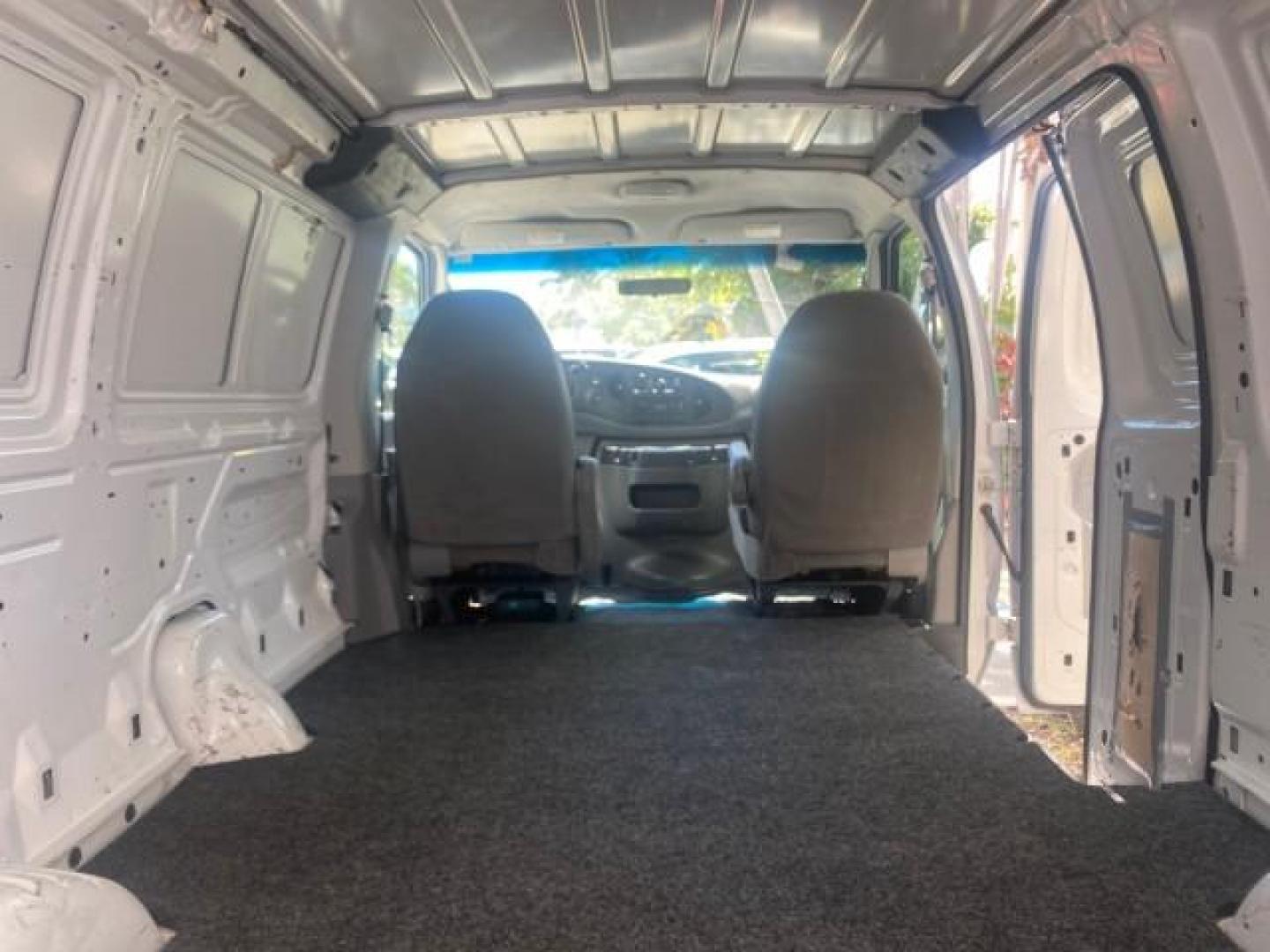 2006 Oxford White /Medium Flint Ford Econoline Cargo Van E350 LOW MILES 66,160 (1FTSE34L56D) with an 5.4L SOHC EFI V8 Triton Engine engine, Automatic transmission, located at 4701 North Dixie Hwy, Pompano Beach, FL, 33064, (954) 422-2889, 26.240938, -80.123474 - OUR WEBPAGE FLORIDACARS1.COM HAS OVER 100 PHOTOS AND FREE CARFAX LINK 2006 FORD E-SERIES E-350 SD CARGO VIN: 1FTSE34L56DB06011 1 F T S E 3 4 L 5 6 D B 0 6 0 1 1 VAN 5.4L V8 F GASOLINE REAR WHEEL DRIVE Top Features Vinyl Seats Basic Features ABS Brakes AM/FM Stereo Air Conditioning Automatic Transmis - Photo#78