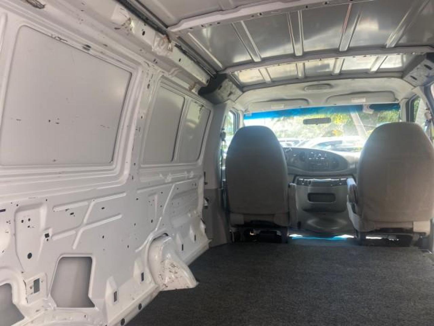 2006 Oxford White /Medium Flint Ford Econoline Cargo Van E350 LOW MILES 66,160 (1FTSE34L56D) with an 5.4L SOHC EFI V8 Triton Engine engine, Automatic transmission, located at 4701 North Dixie Hwy, Pompano Beach, FL, 33064, (954) 422-2889, 26.240938, -80.123474 - OUR WEBPAGE FLORIDACARS1.COM HAS OVER 100 PHOTOS AND FREE CARFAX LINK 2006 FORD E-SERIES E-350 SD CARGO VIN: 1FTSE34L56DB06011 1 F T S E 3 4 L 5 6 D B 0 6 0 1 1 VAN 5.4L V8 F GASOLINE REAR WHEEL DRIVE Top Features Vinyl Seats Basic Features ABS Brakes AM/FM Stereo Air Conditioning Automatic Transmis - Photo#79