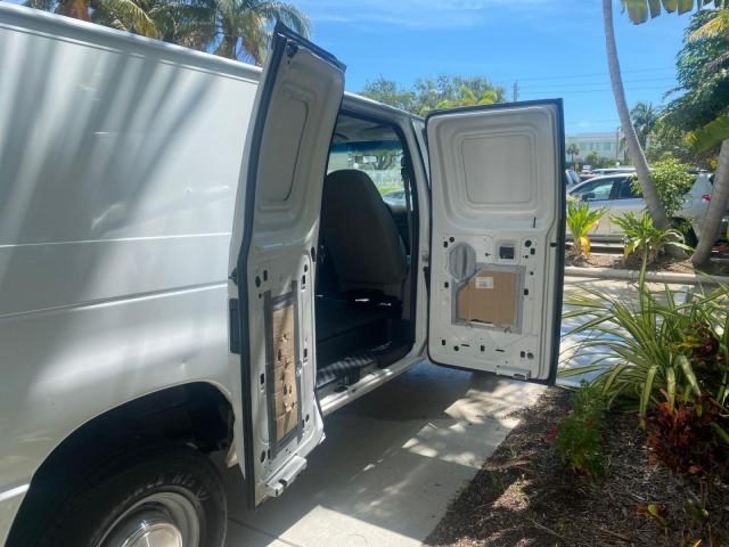 2006 Oxford White /Medium Flint Ford Econoline Cargo Van E350 LOW MILES 66,160 (1FTSE34L56D) with an 5.4L SOHC EFI V8 Triton Engine engine, Automatic transmission, located at 4701 North Dixie Hwy, Pompano Beach, FL, 33064, (954) 422-2889, 26.240938, -80.123474 - OUR WEBPAGE FLORIDACARS1.COM HAS OVER 100 PHOTOS AND FREE CARFAX LINK 2006 FORD E-SERIES E-350 SD CARGO VIN: 1FTSE34L56DB06011 1 F T S E 3 4 L 5 6 D B 0 6 0 1 1 VAN 5.4L V8 F GASOLINE REAR WHEEL DRIVE Top Features Vinyl Seats Basic Features ABS Brakes AM/FM Stereo Air Conditioning Automatic Transmis - Photo#85